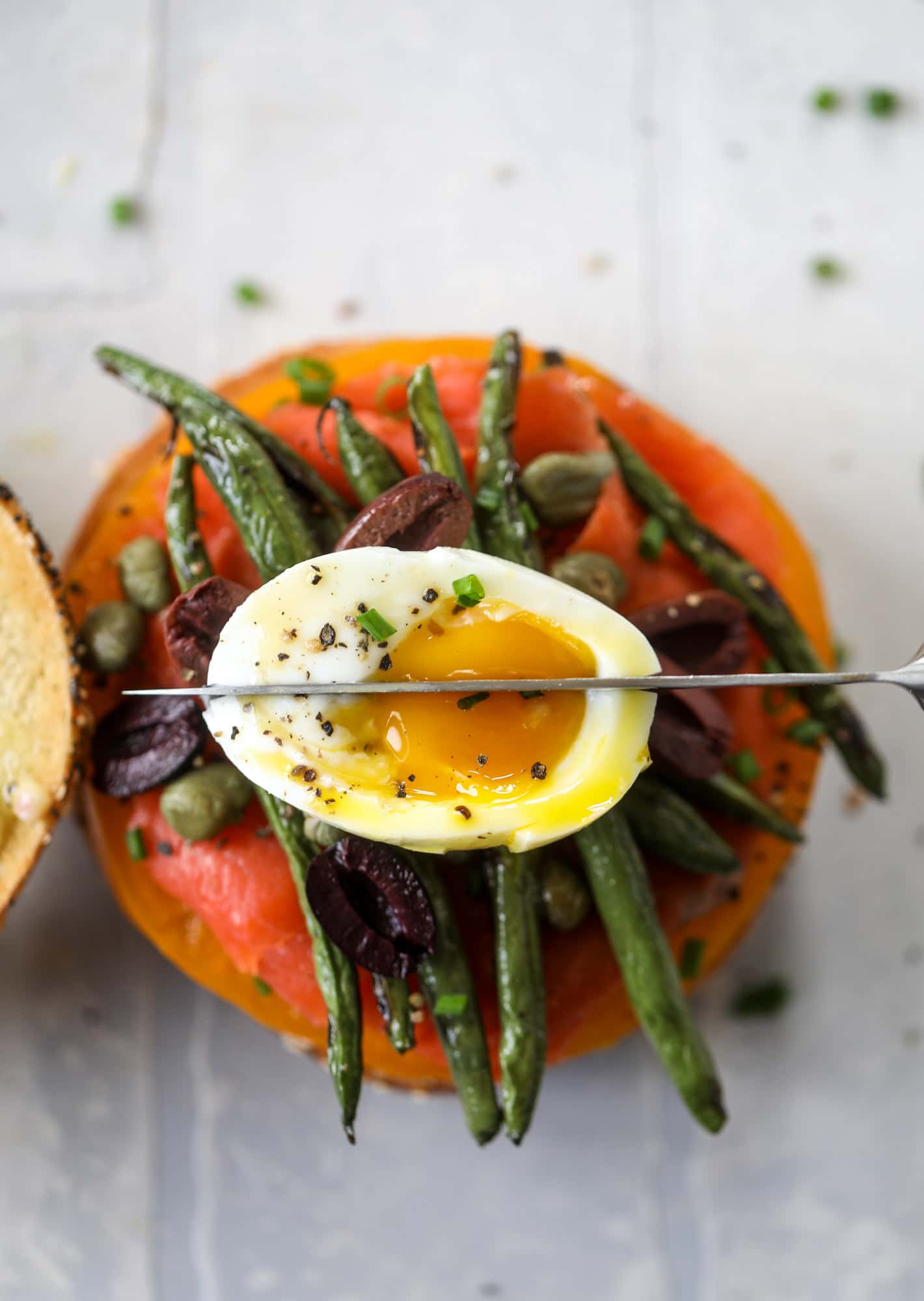 These nicoise bagels are a spin on my favorite salad! Loaded with smoked salmon, blistered green beans and tons of goodness. They are delish!