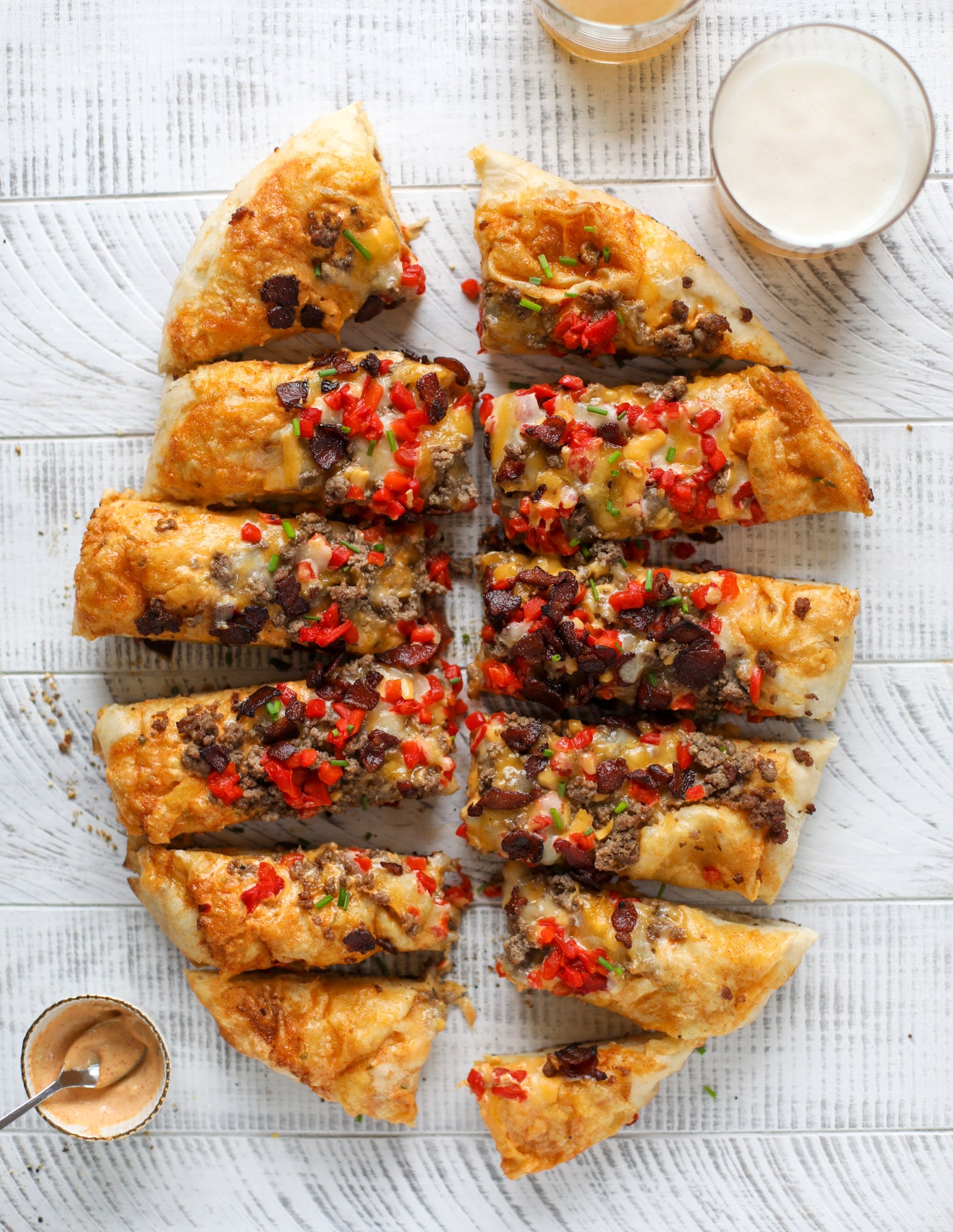 This grilled cheeseburger pizza is my take on the smoke shack burger! Cheddar, bacon, cherry peppers and special sauce make this impossible to resist.