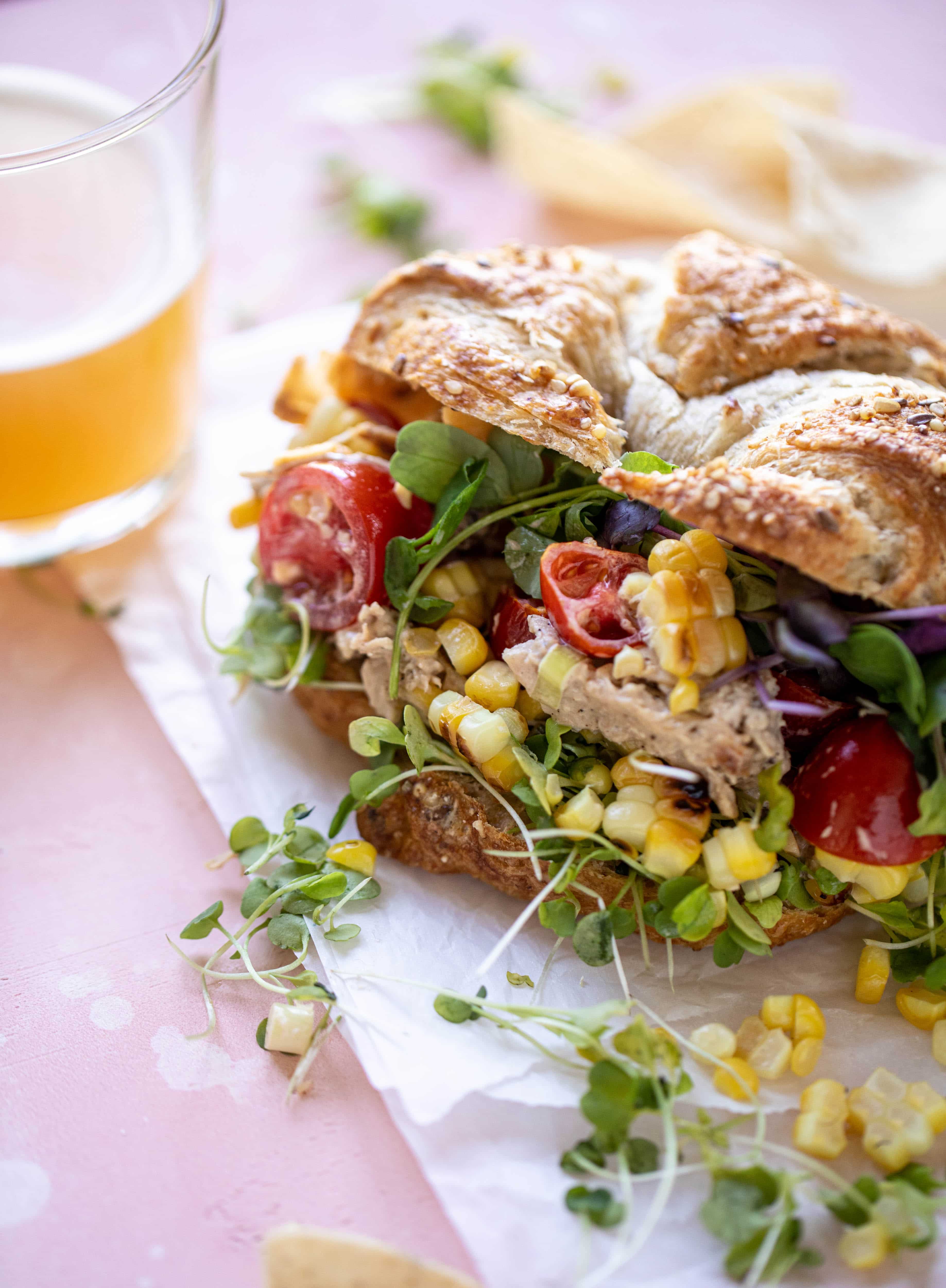 This smoky summer chicken salad is incredible! So much flavor from grilled chicken, sweet cherry tomatoes, corn, cheddar cheese and a secret ingredient!
