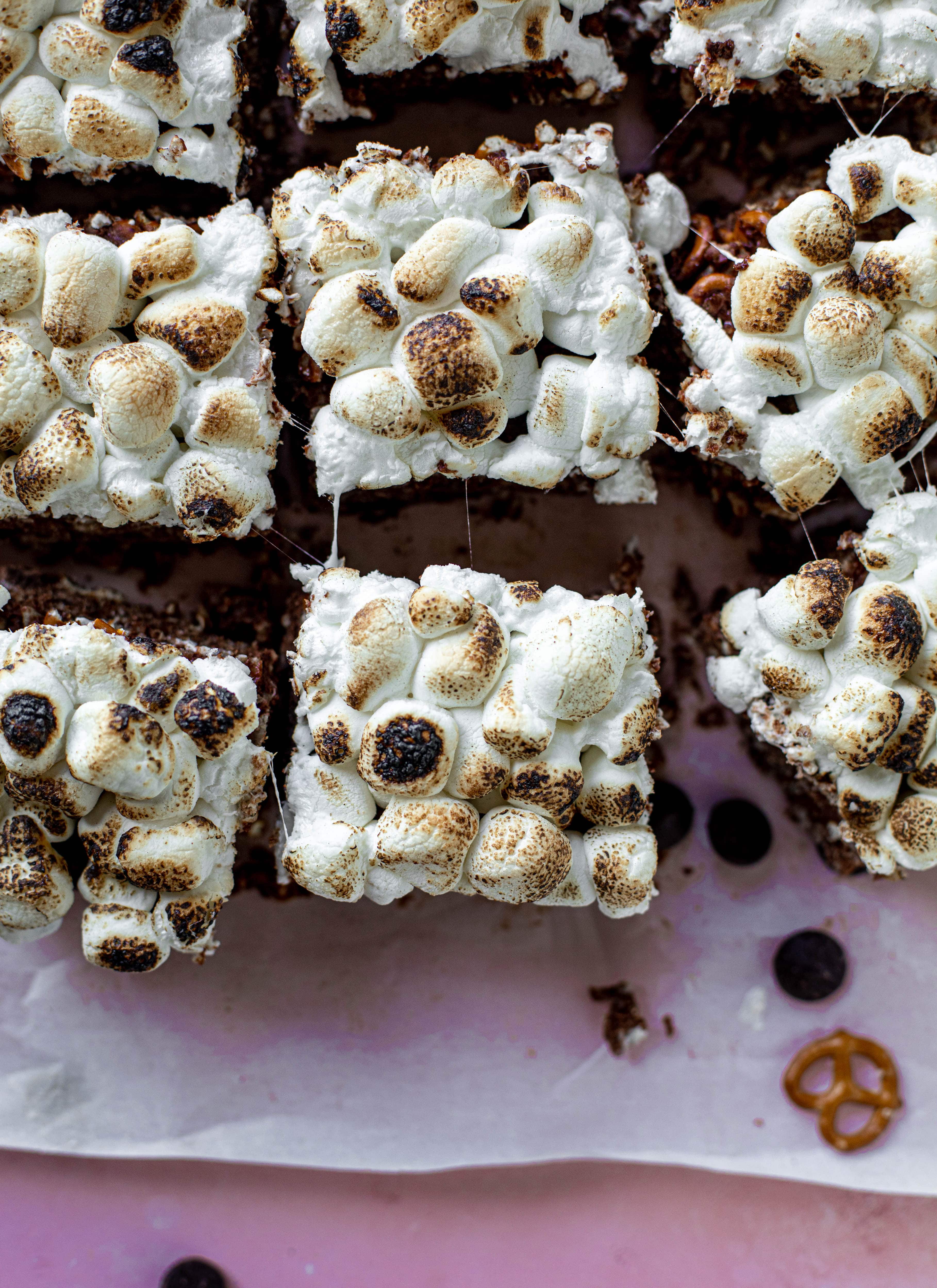 These indulgent s'mores bars are crispy and crunchy and studded with salted pretzels! Toasted marshmallow and dark chocolate make these the best treat ever!