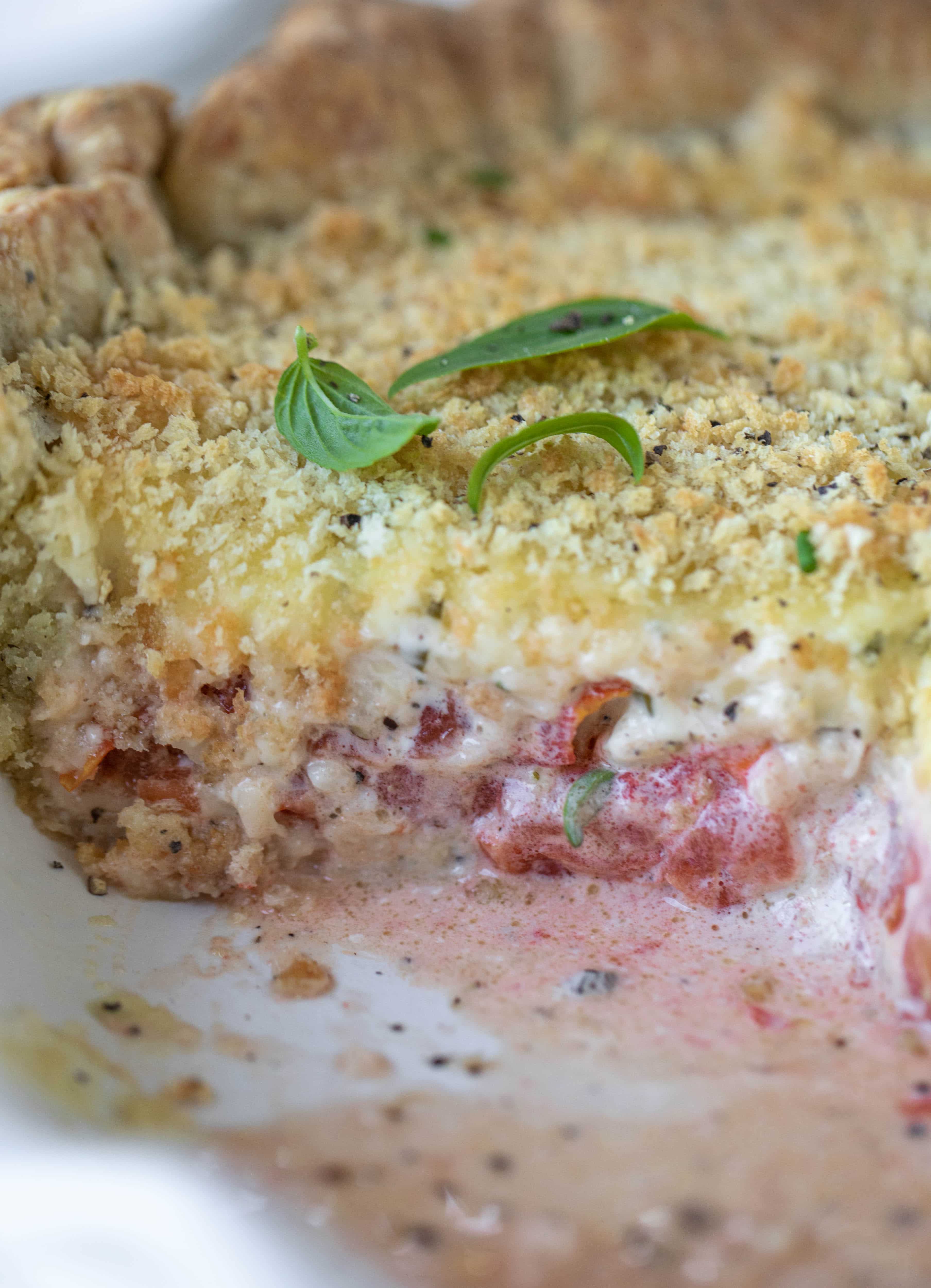 This summer tomato pie is the best dinner ever! Cheddar herb crust, ripe, juicy tomatoes and a cheesy, crunchy layer on top. It's irresistible. 