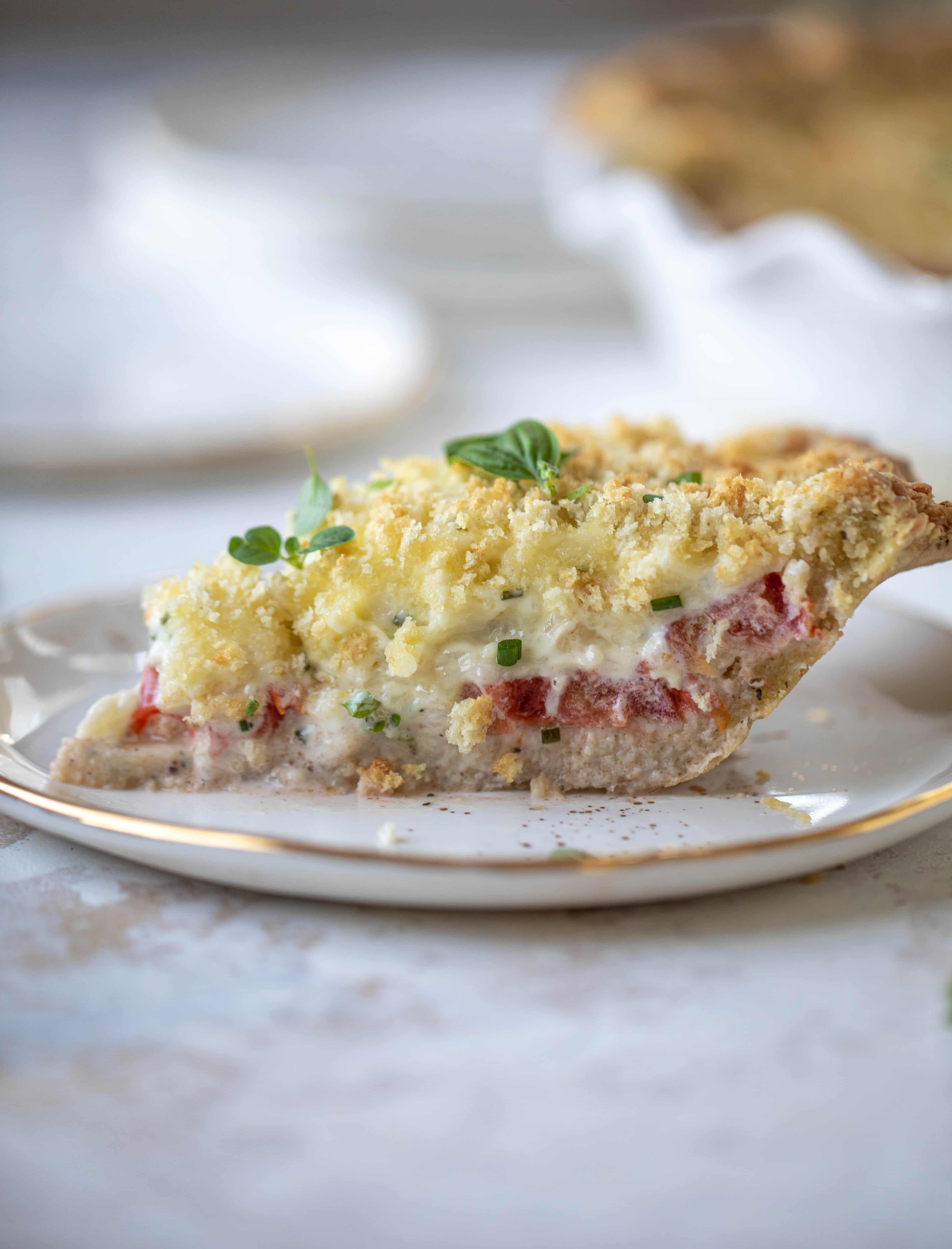 This summer tomato pie is the best dinner ever! Cheddar herb crust, ripe, juicy tomatoes and a cheesy, crunchy layer on top. It's irresistible. 
