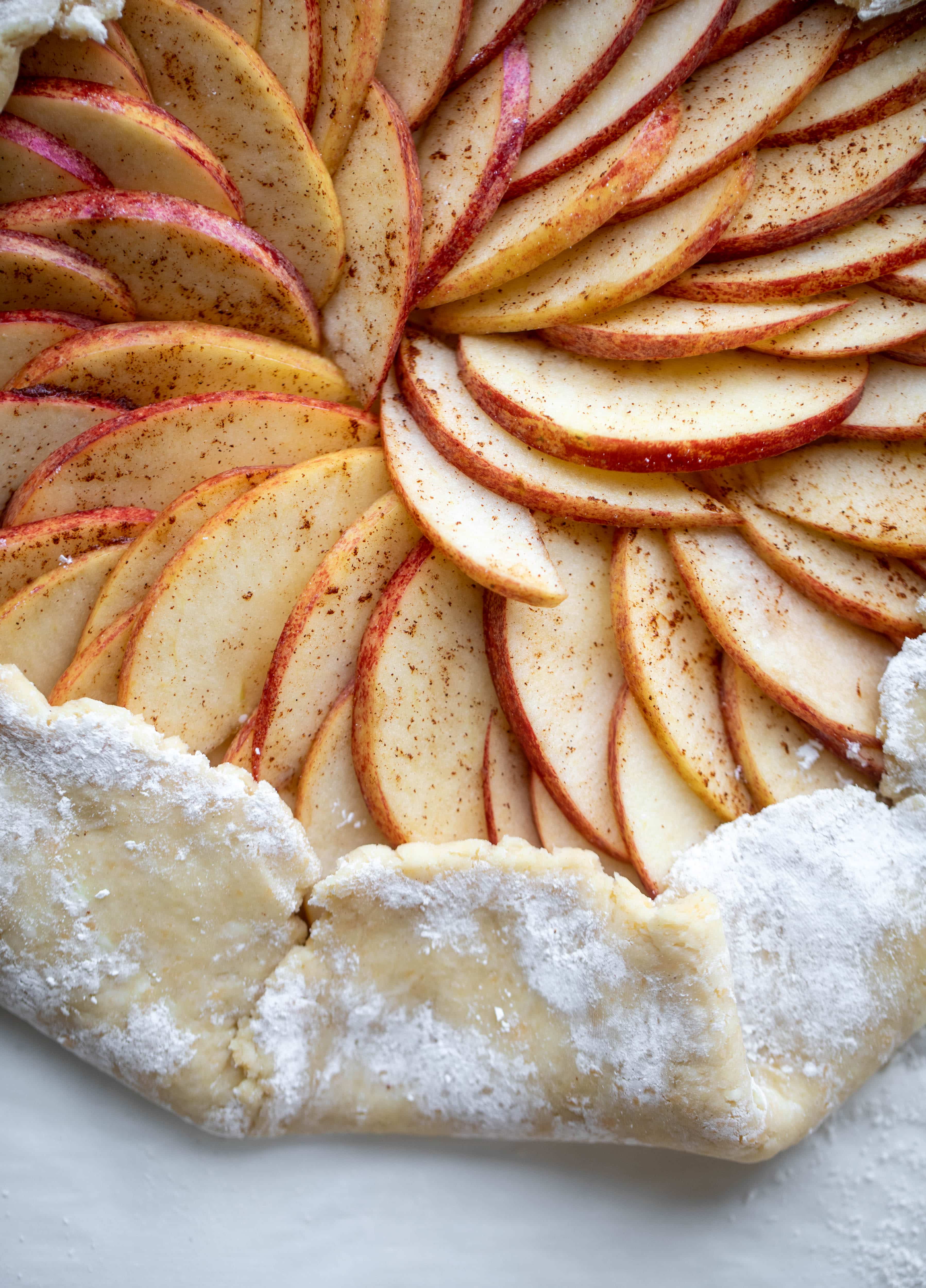 This apple cheddar galette is made with honeycrisp apples, set in a cheddar herb crust and brushed with thyme butter! So delicious and perfect for fall.