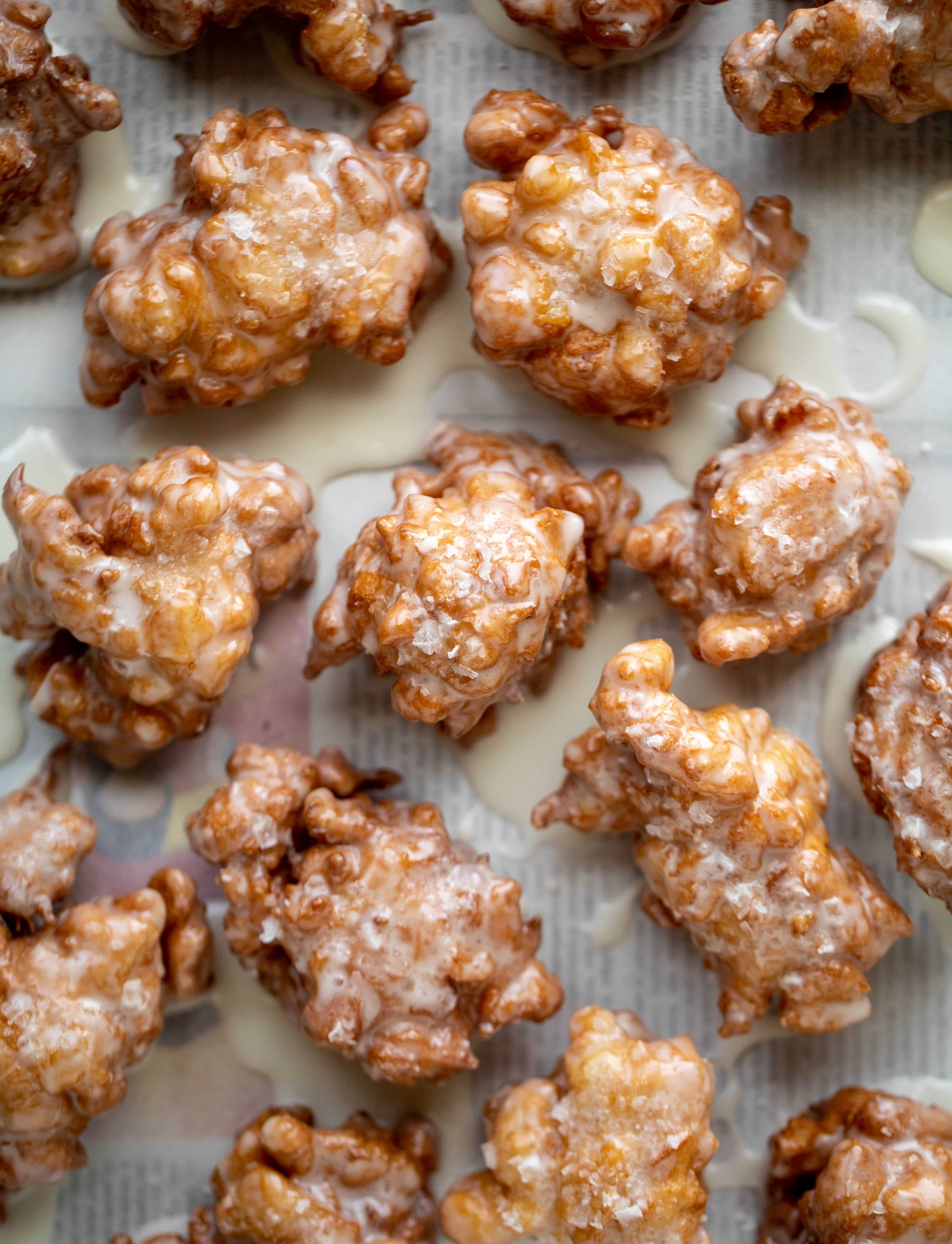These salted apple fritters use honeycrisp apples and flaked sea salt for a fall flavor explosion. These are the best treat ever!