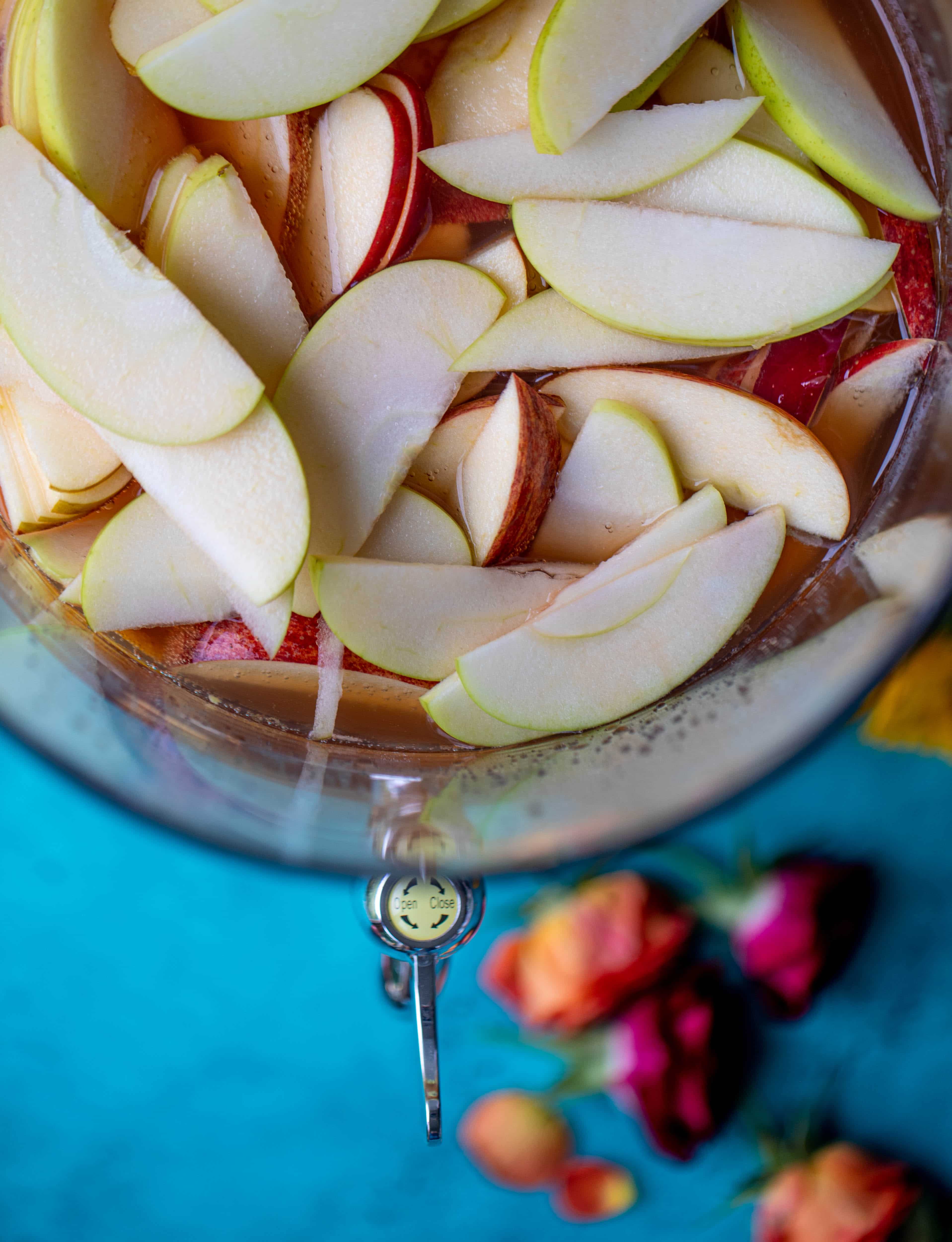 This apple cider punch recipe has tons of fall flavor! Apple cider, aperol, pomegranate soda and prosecco come together to create a bubbly treat!
