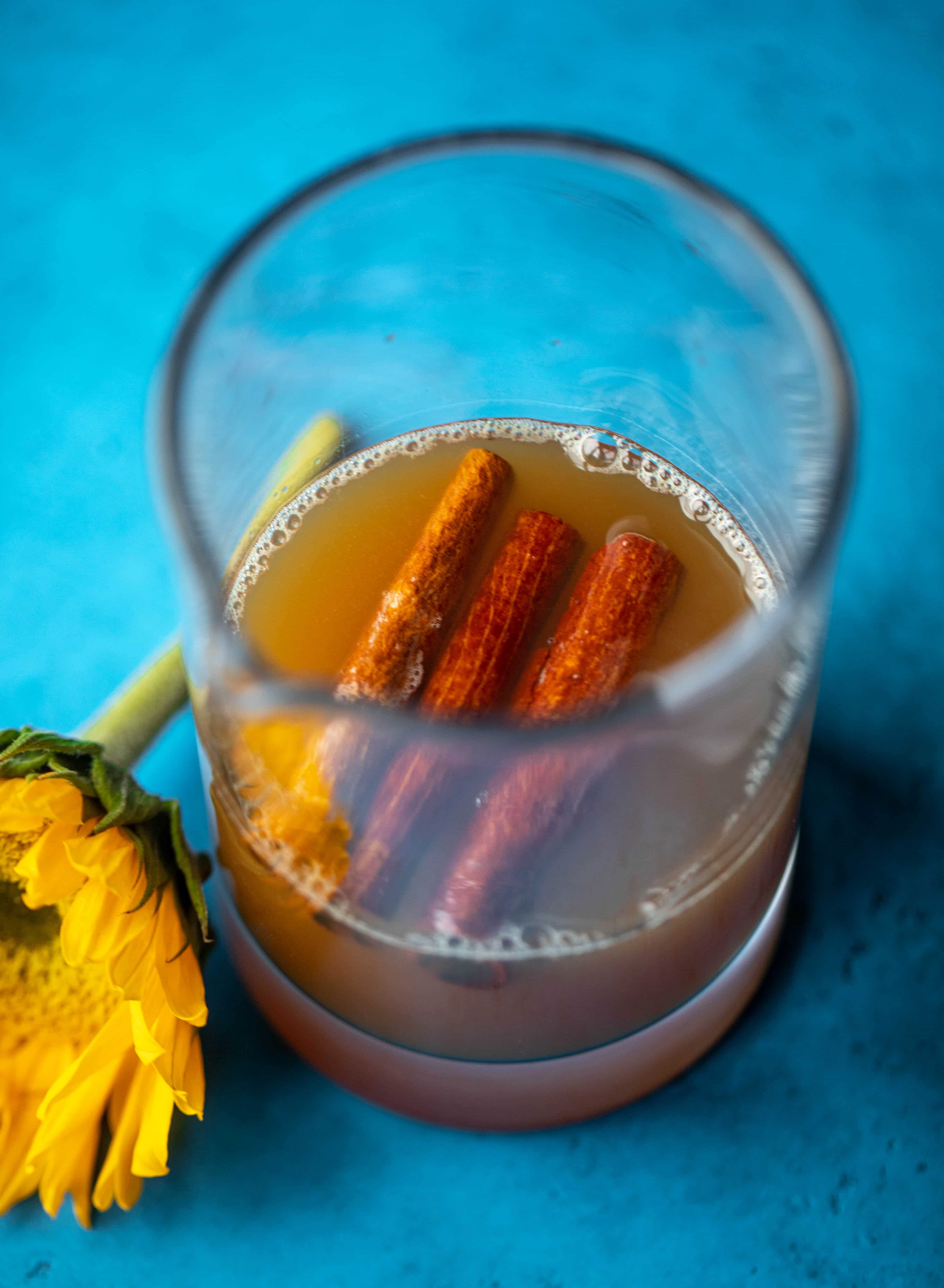 Everything I love about fall is in one little cocktail right here! If you love whiskey, this cinnamon spiced cider and splash of maple makes a sour so good!