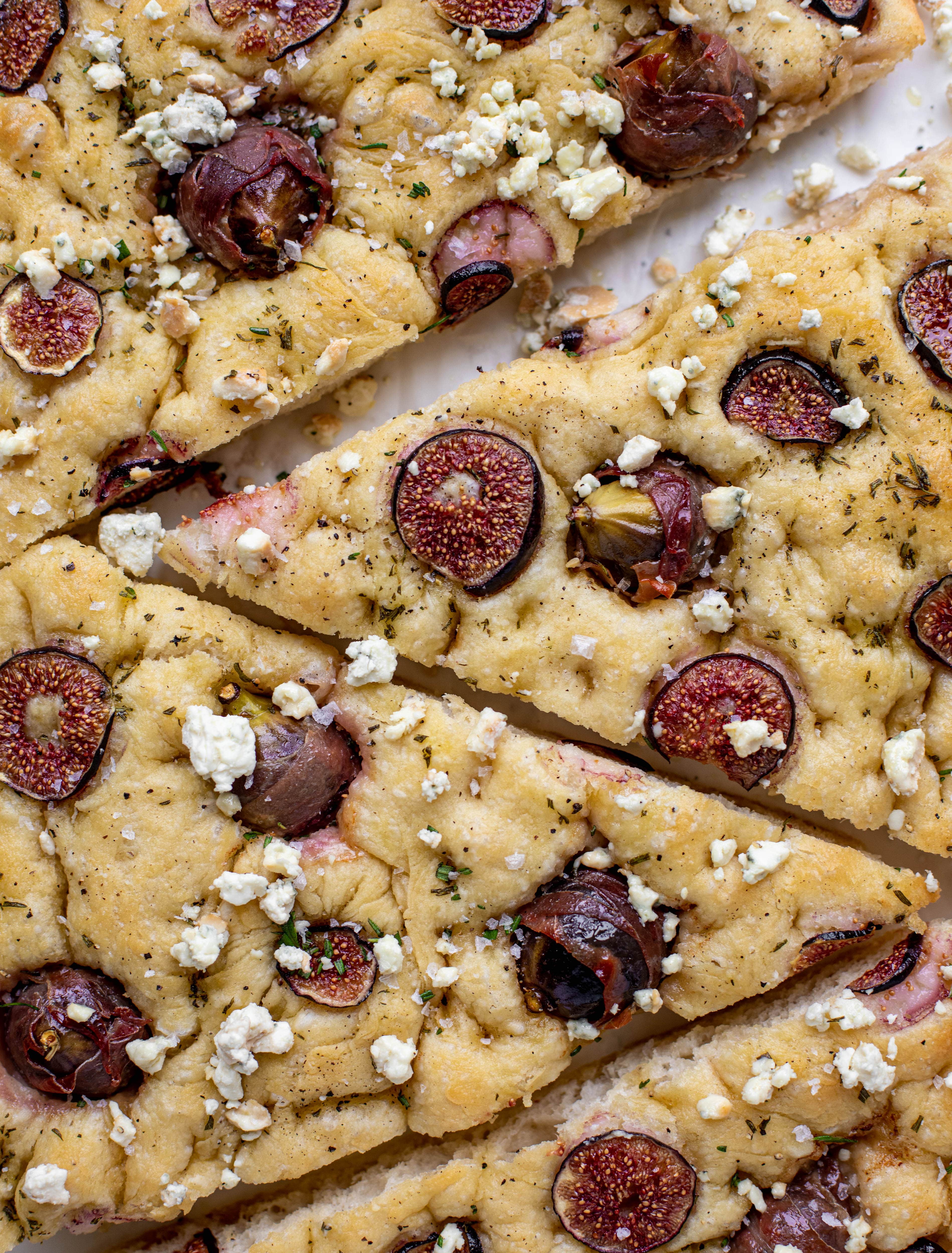 This stuffed fig focaccia bread is such an amazing way to use figs! Golden, toasty, salted focaccia studded with fig jewels. It's delicious and pretty!