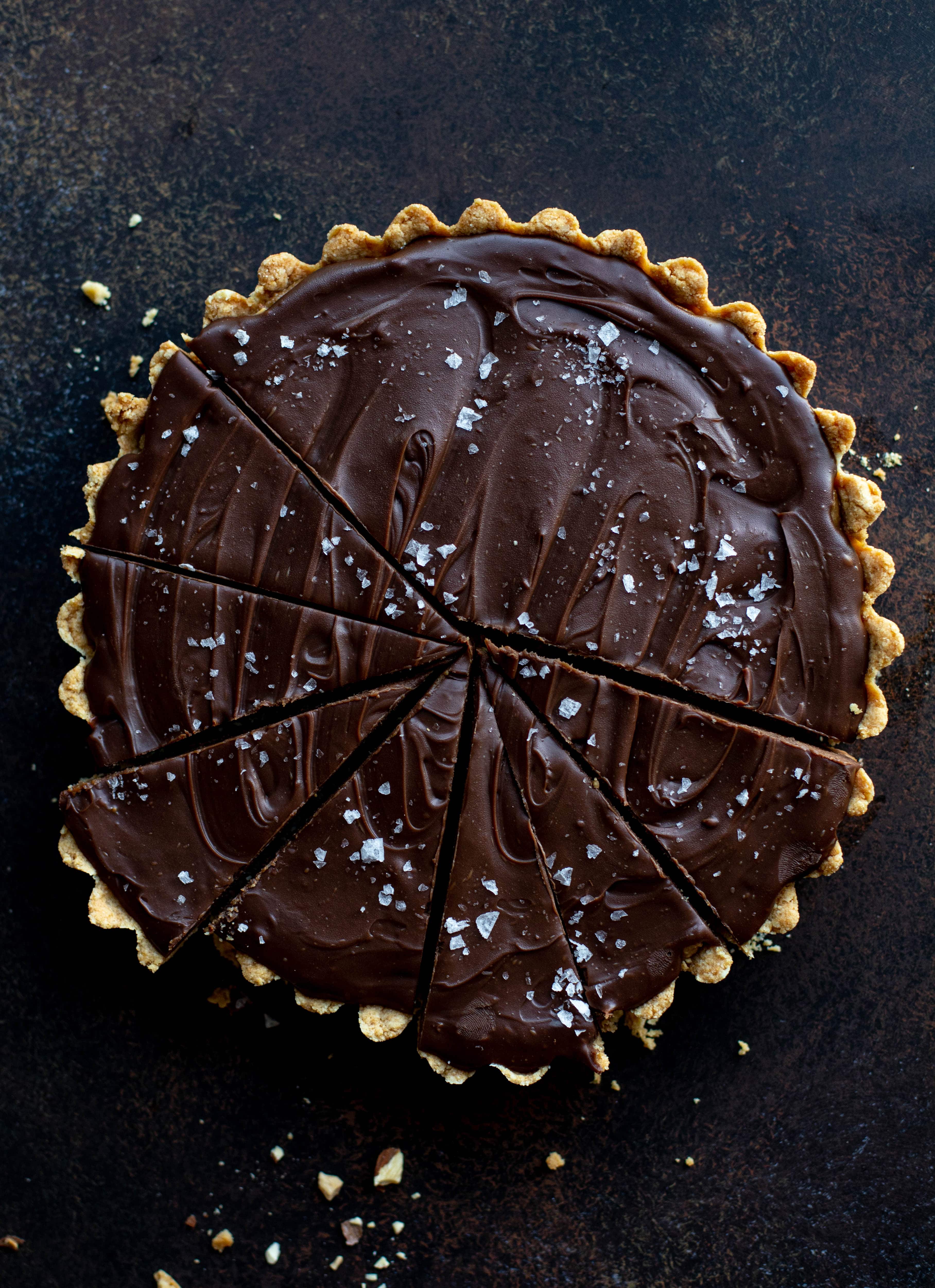 This snickers almond tart is made with an almond crust, homemade almond butter caramel and a chocolate ganache. It's to die for!