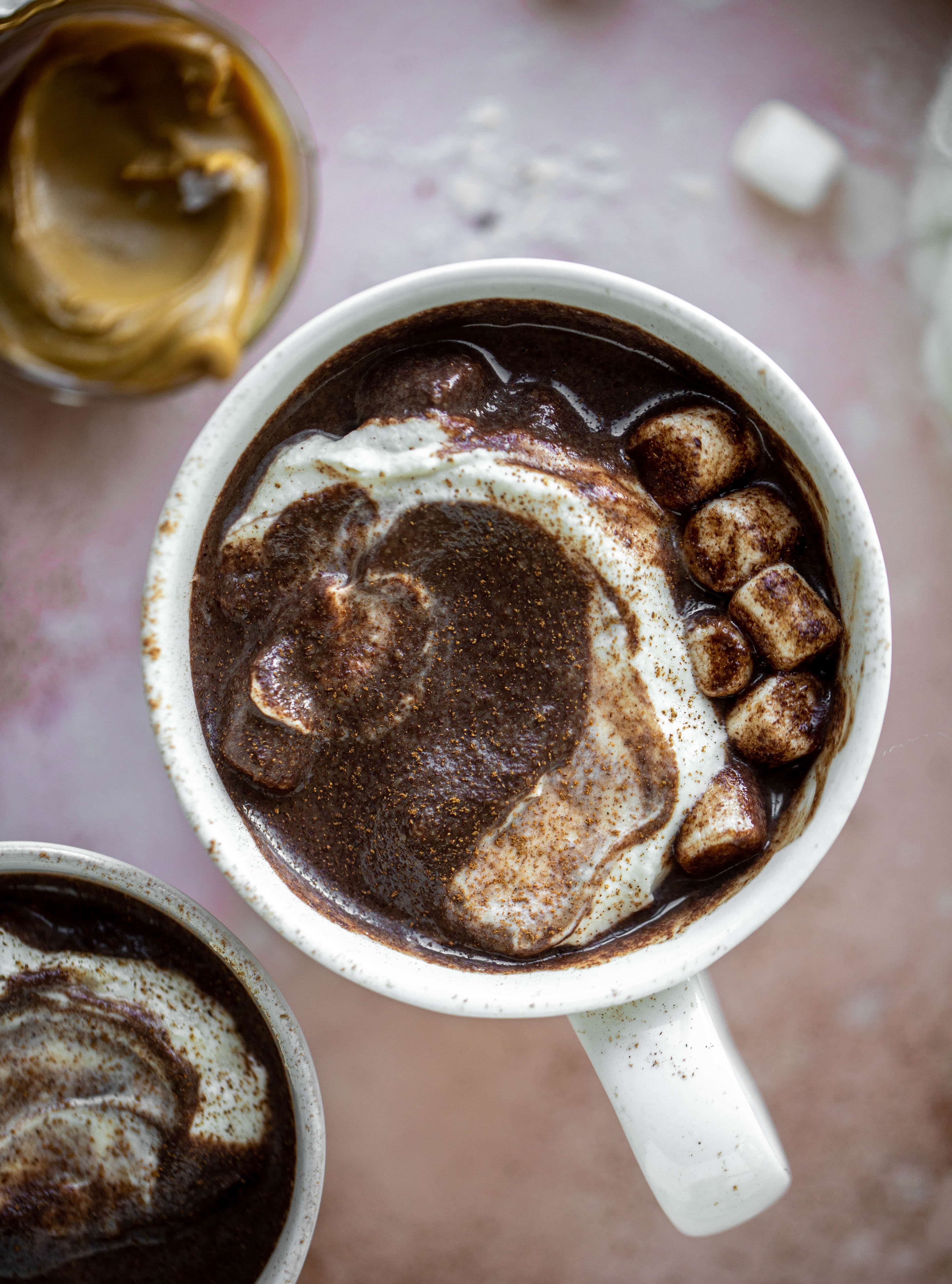 This salted peanut butter hot chocolate is a hug in a mug! It's super decadent, indulgent and cozy. Everyone's favorite flavors in one drink!