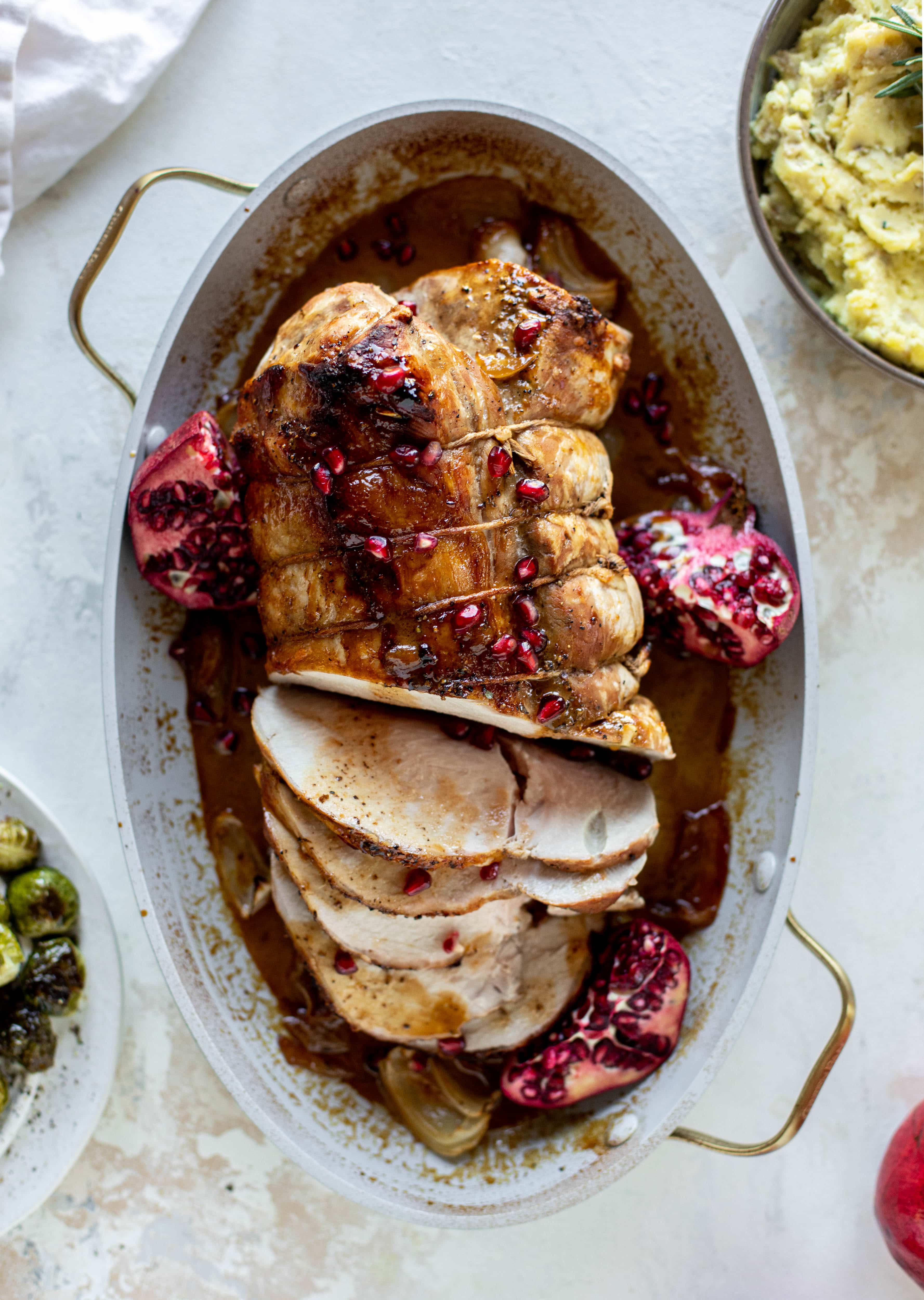 This pork loin roast is perfect for the holiday or winter season! Pomegranate and cider glazed, it's wonderful! Serve with smashed rosemary potatoes.