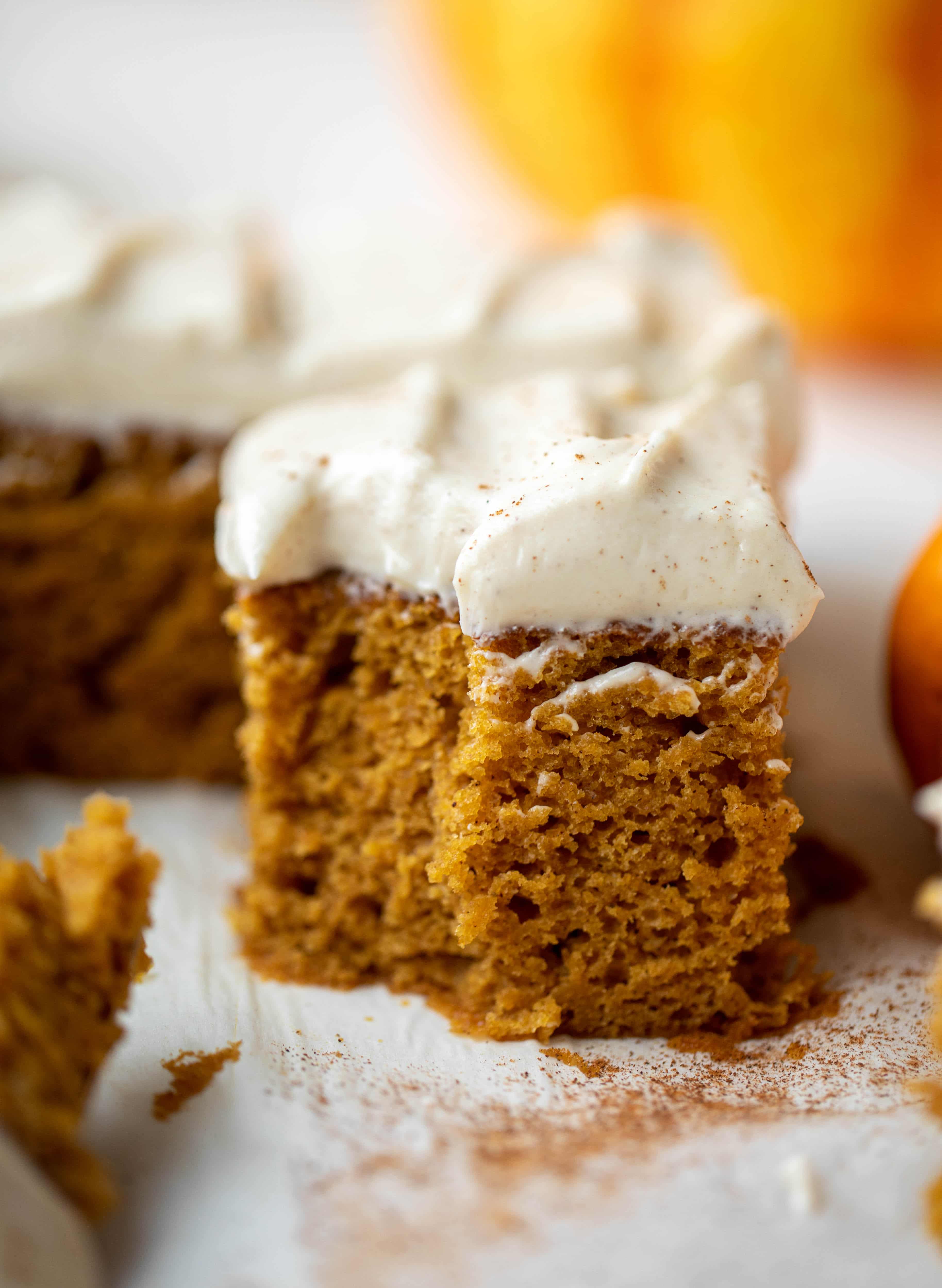 This pumpkin sheet cake is a legit pumpkin dream cake! It's so moist and fluffy and flavorful. With a blanket of cinnamon cream cheese frosting!
