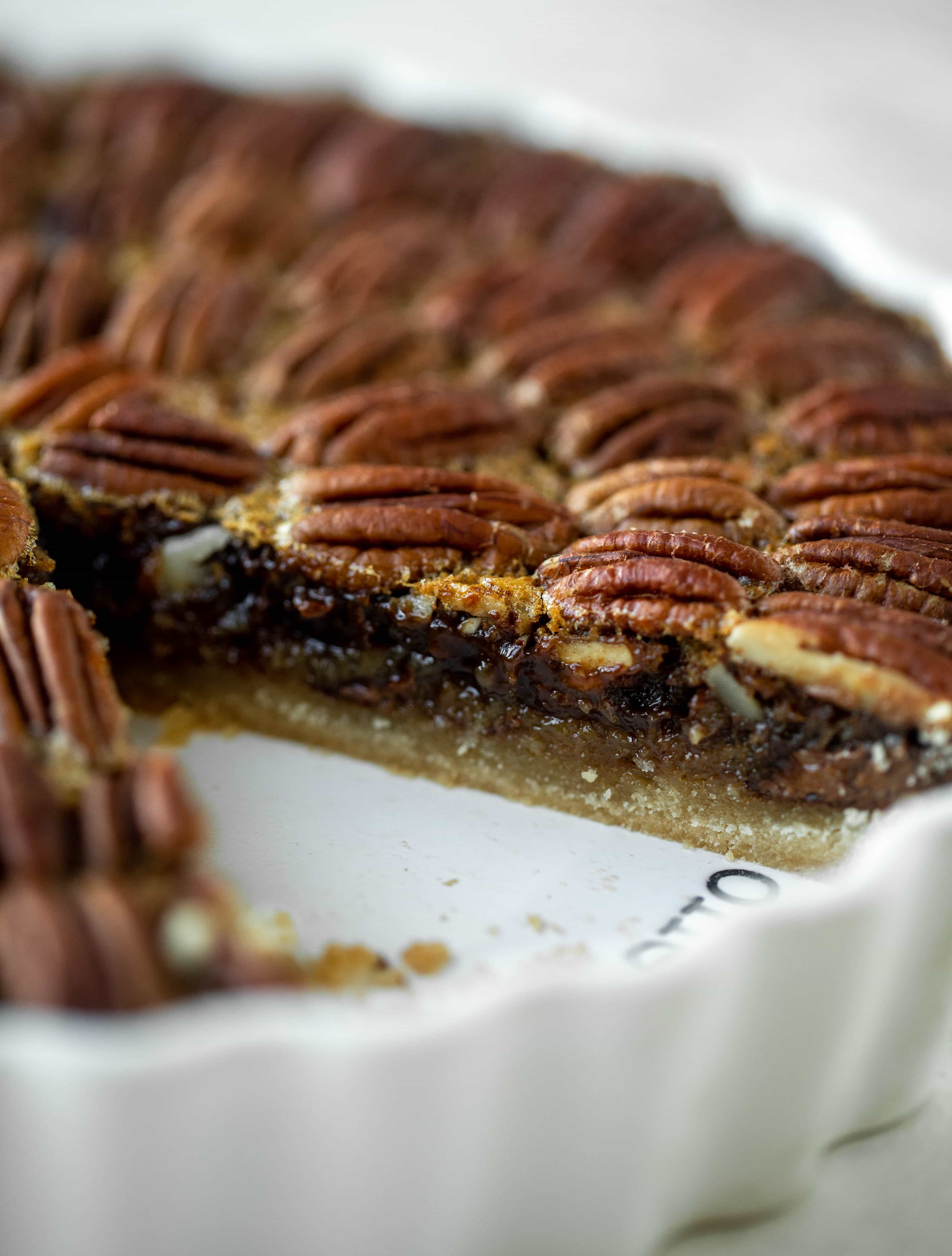 This chocolate pecan tart is the best dessert ever. Chocolate fudge and gooey pecan pie in a shortbread crust - everyone goes crazy! 