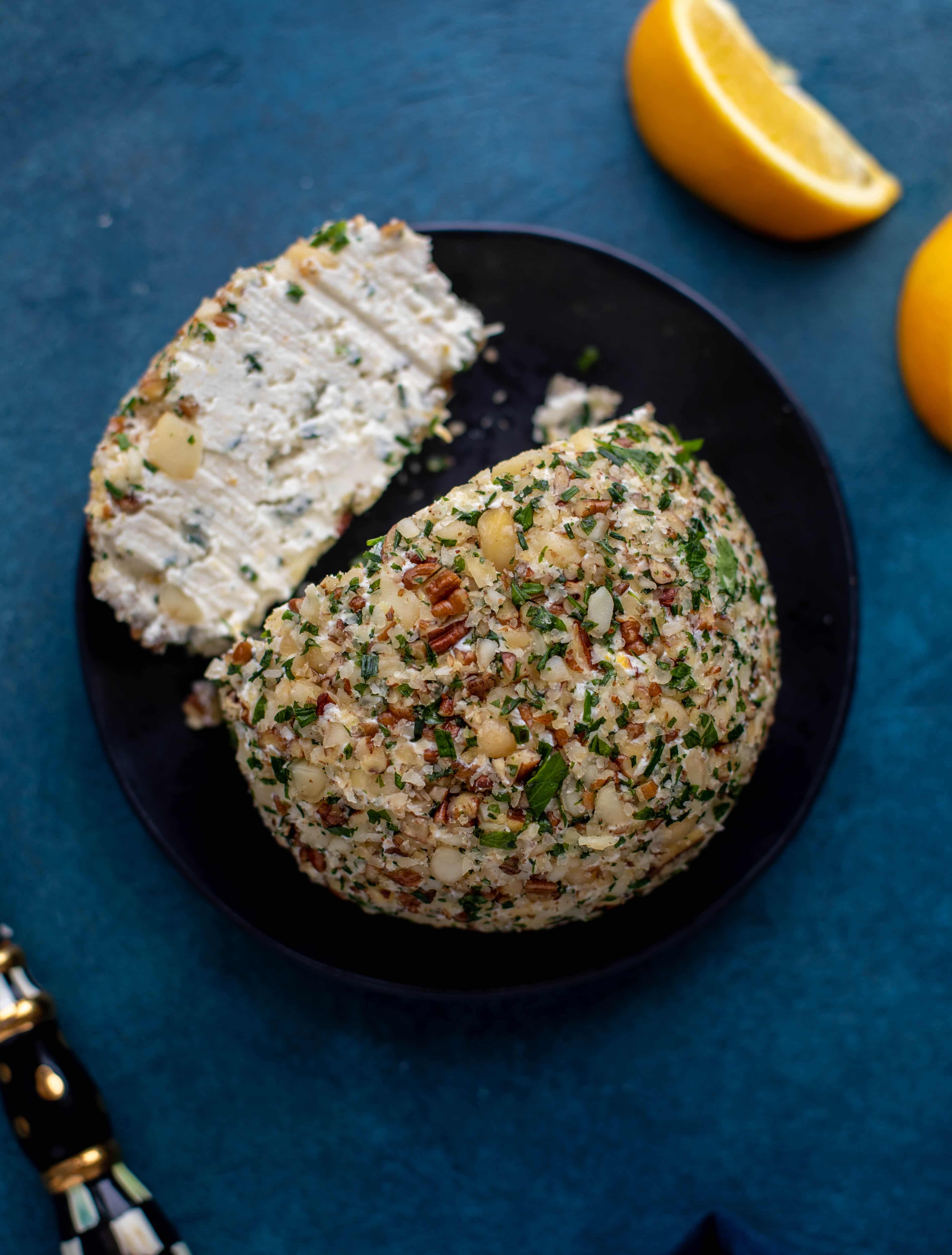 This macadamia nut cheeseball is flavored with fresh orange, spices, crispy sage and pecorino cheese. It's the perfect make-ahead snack!