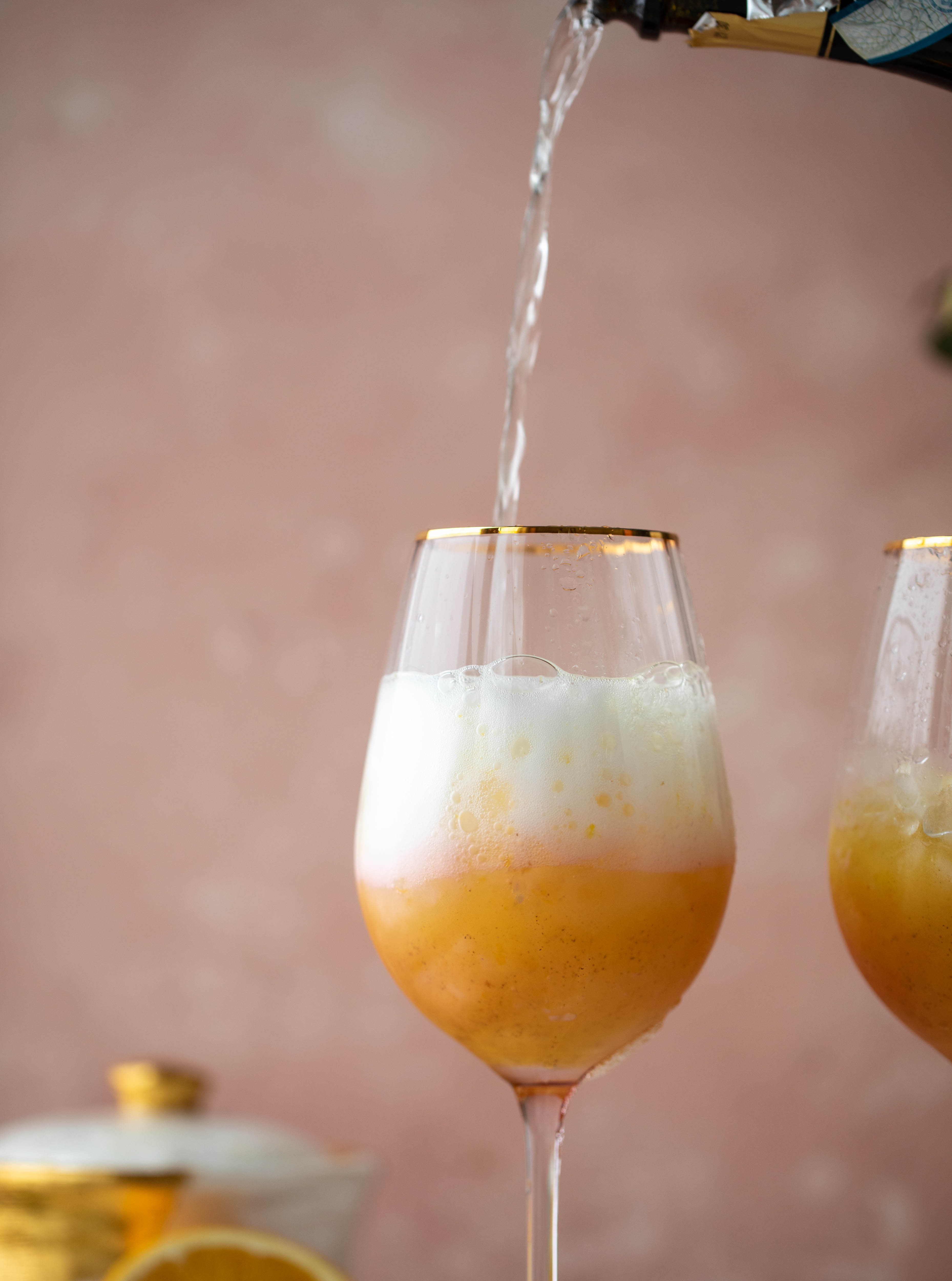 The spiced orange spritzer is a fancier mimosa and similar to an aperol spritz! A fresh spiced orange juice based mixed with prosecco and seltzer. So good!