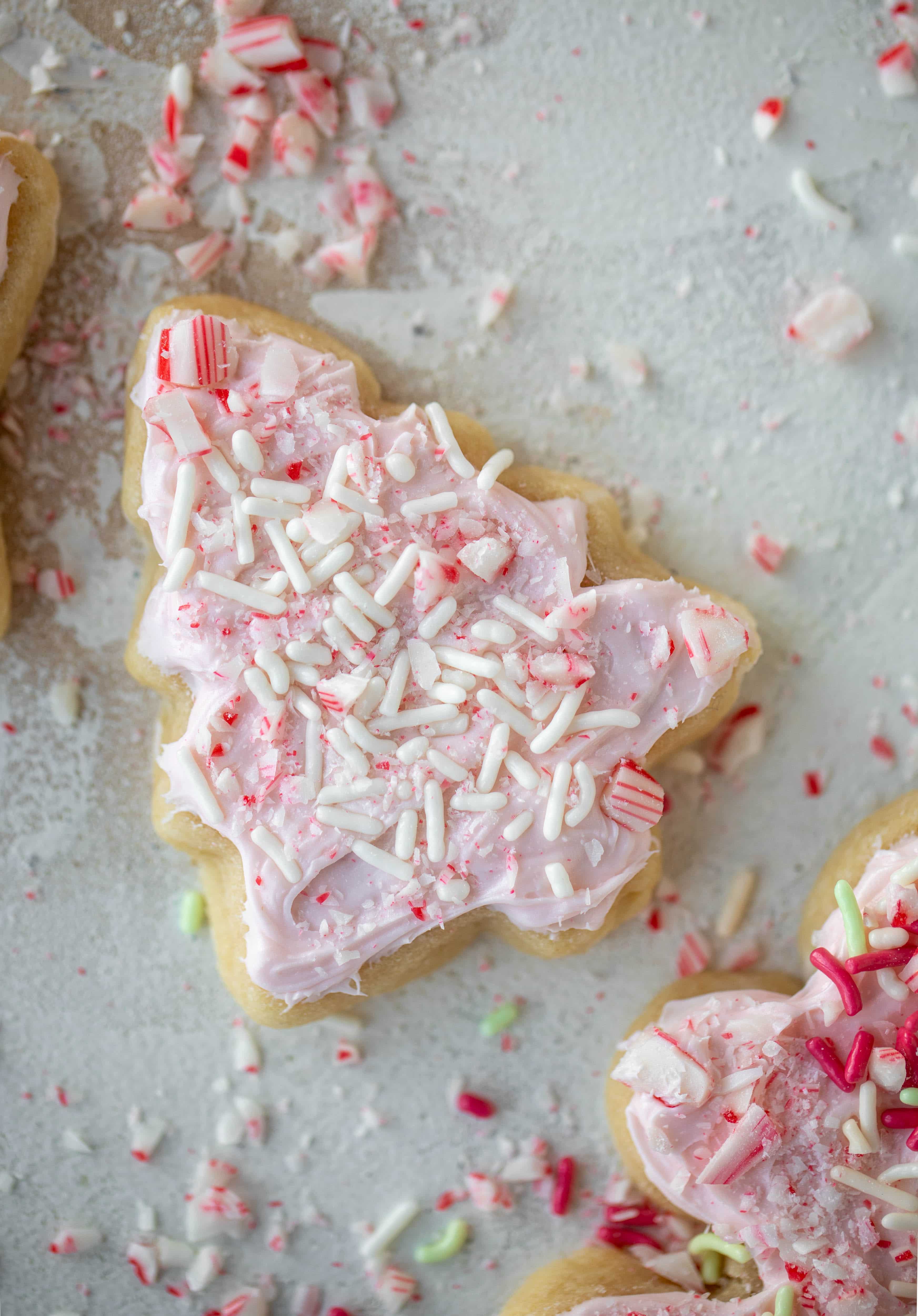 Pink peppermint sugar cookies are classic vanilla cut out cookies topped with peppermint cream cheese frosting. They are delicious! 