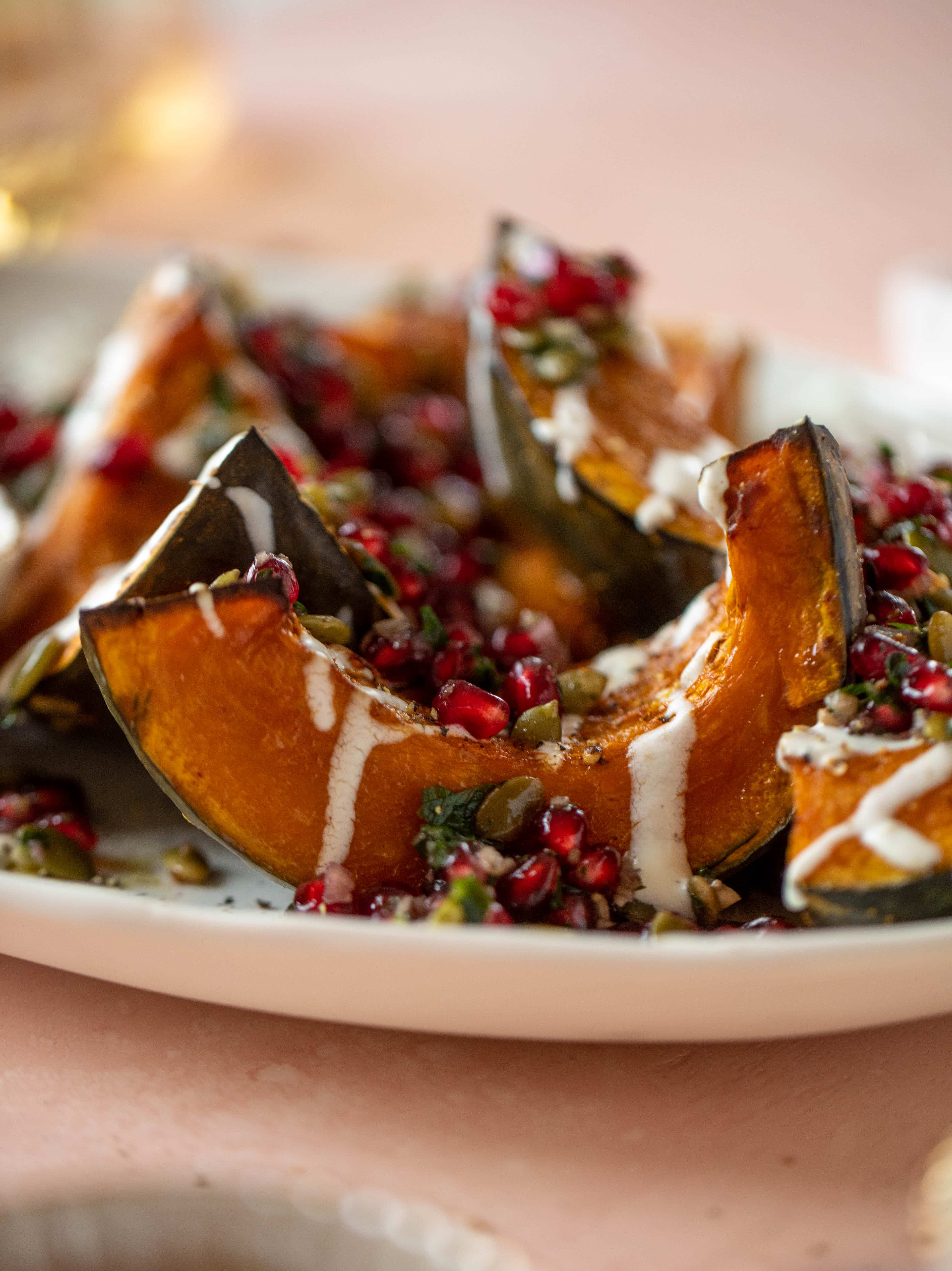 This roasted kabocha squash is caramely and naturally sweet, drizzled with whipped goat cheese and topped with pomegranate pepita relish. It's unreal!
