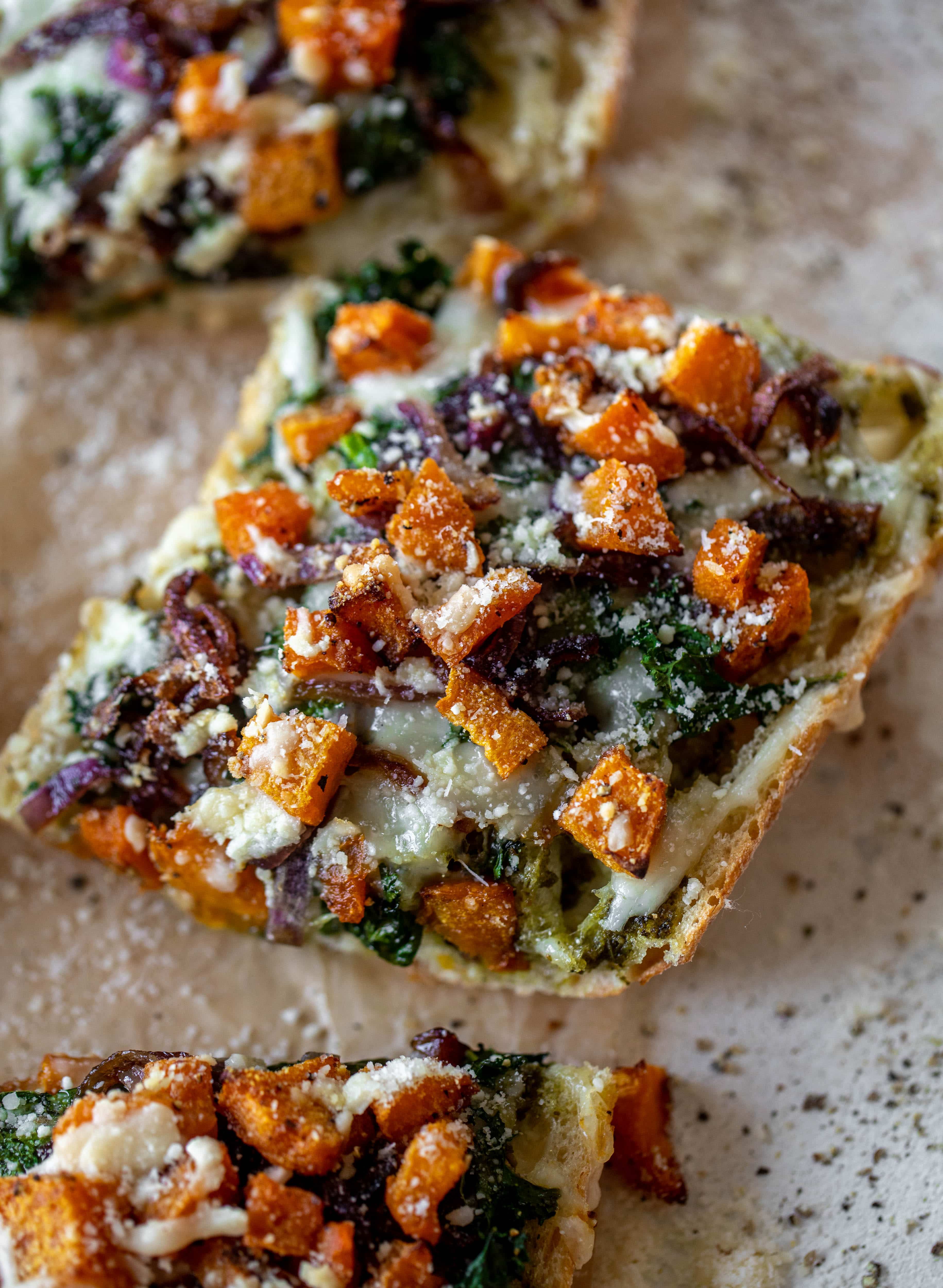 These butternut squash french breads have so much flavor. Pesto, caramelized onions, kale, roasted butternut and tons of fontina cheese. Delicious! 