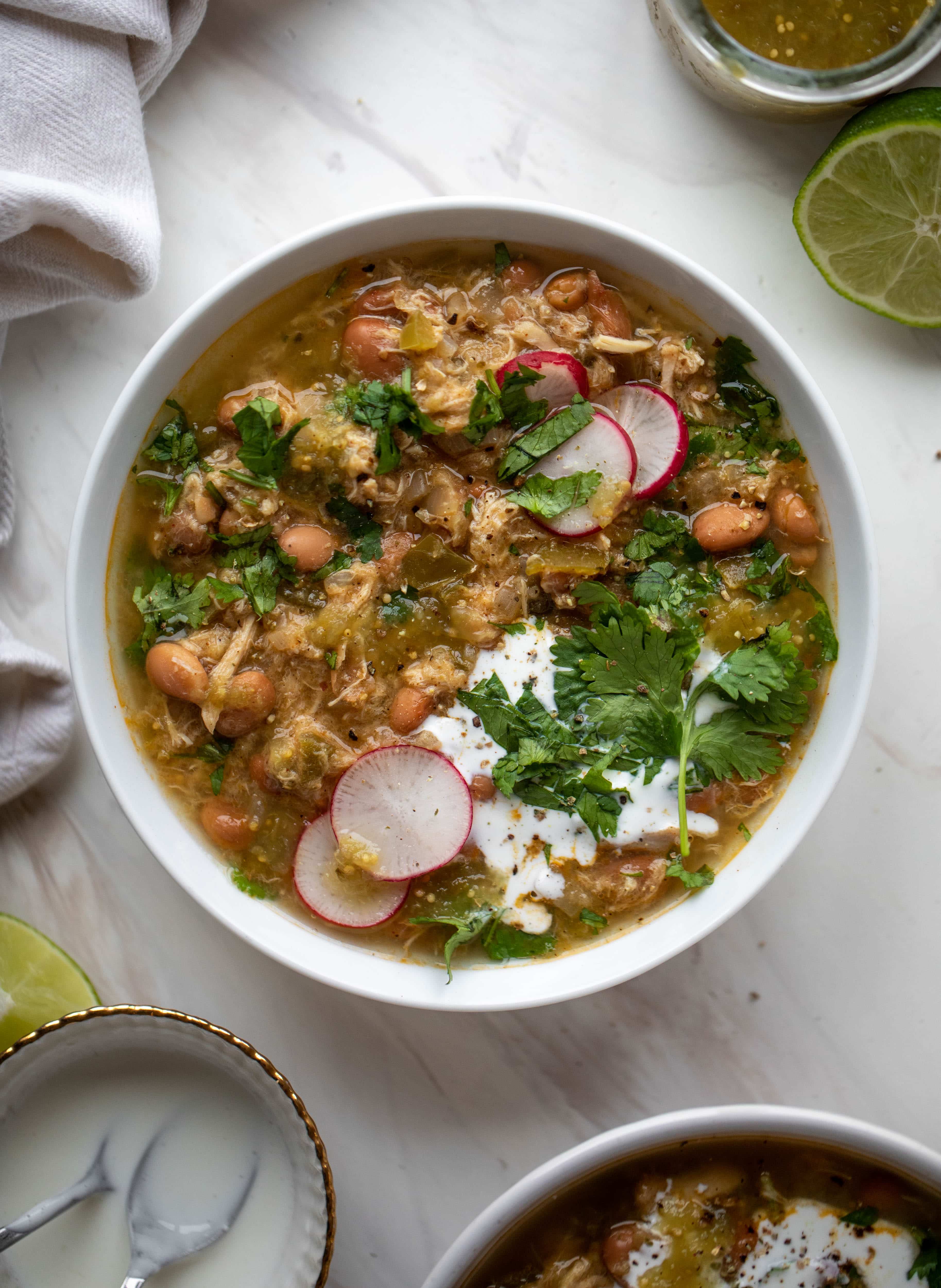 This chicken verde soup is easy to make and comes together quickly. It's served with salted yogurt dolloped on top and it's delish!