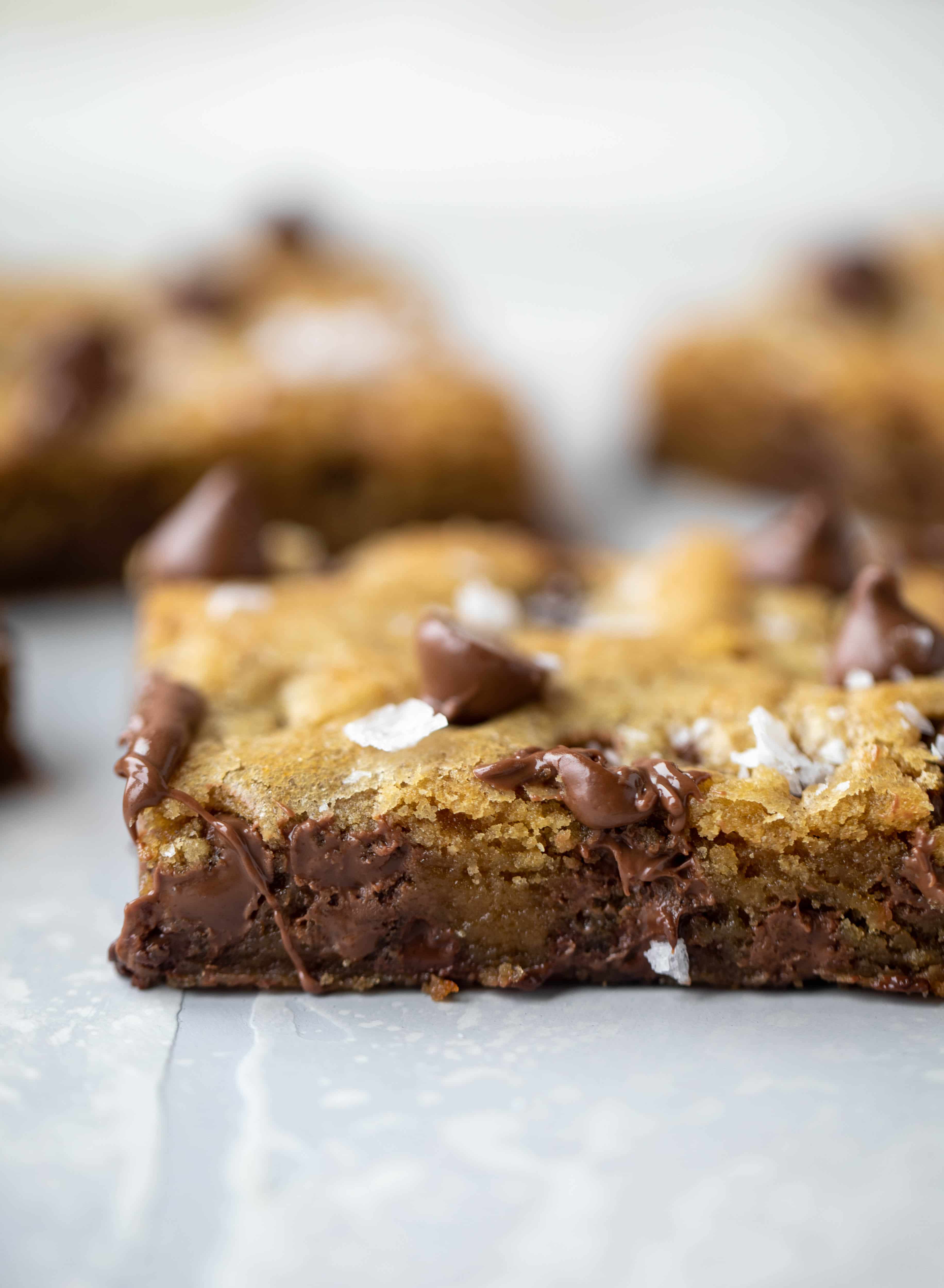 These brown butter chocolate chip cookie bars are chewy, chocolately and sprinkled with flaky salt. What else do you need in life?!