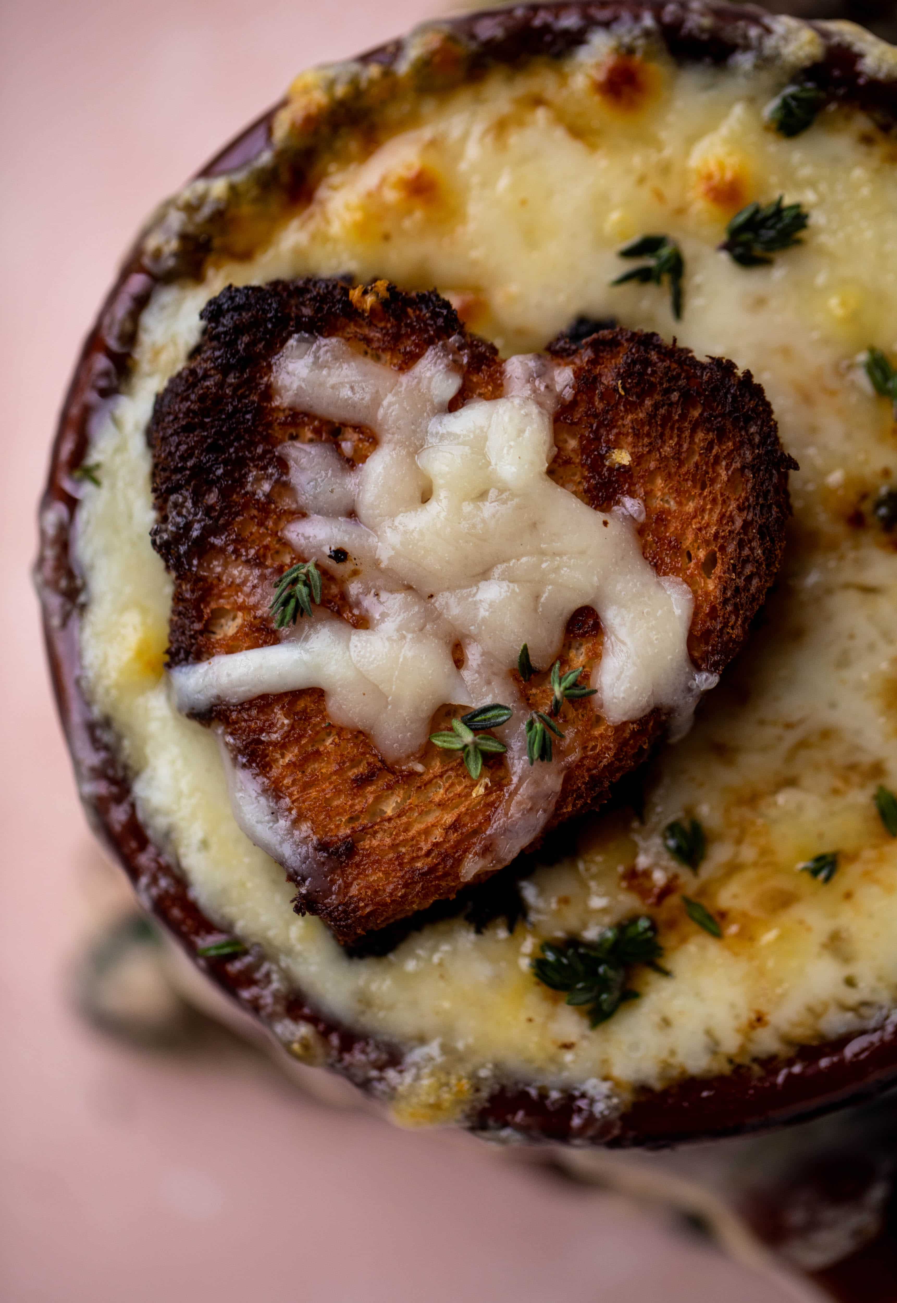 My favorite french onion soup starts with bourbon caramelized onions! Adorable heart croutons and tons of gruyere take it over the top.