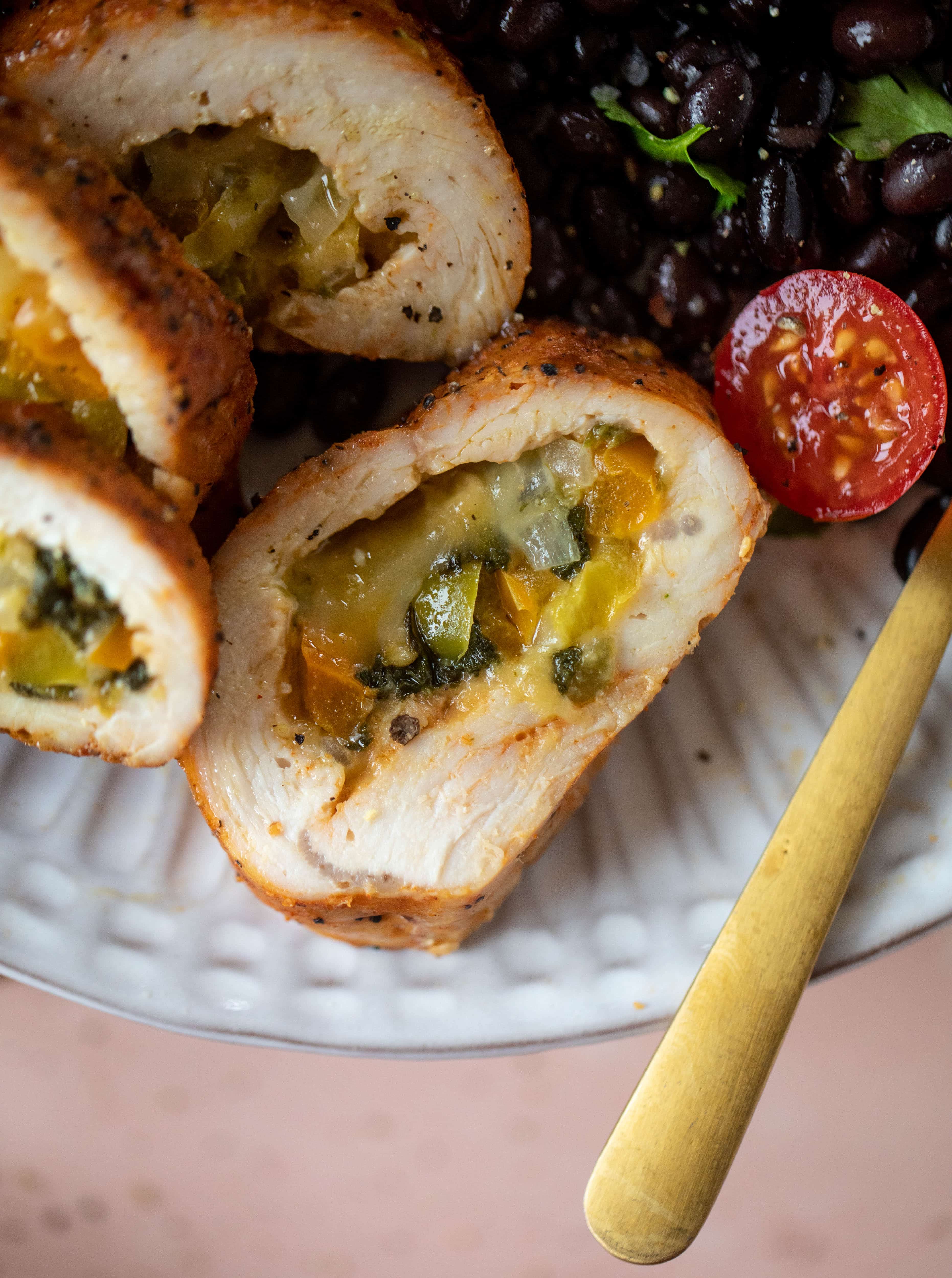 These southwest stuffed turkey tenderloins are so flavorful and filled with spinach, peppers, onions and cheddar! Serve alongside a lime black bean salad.