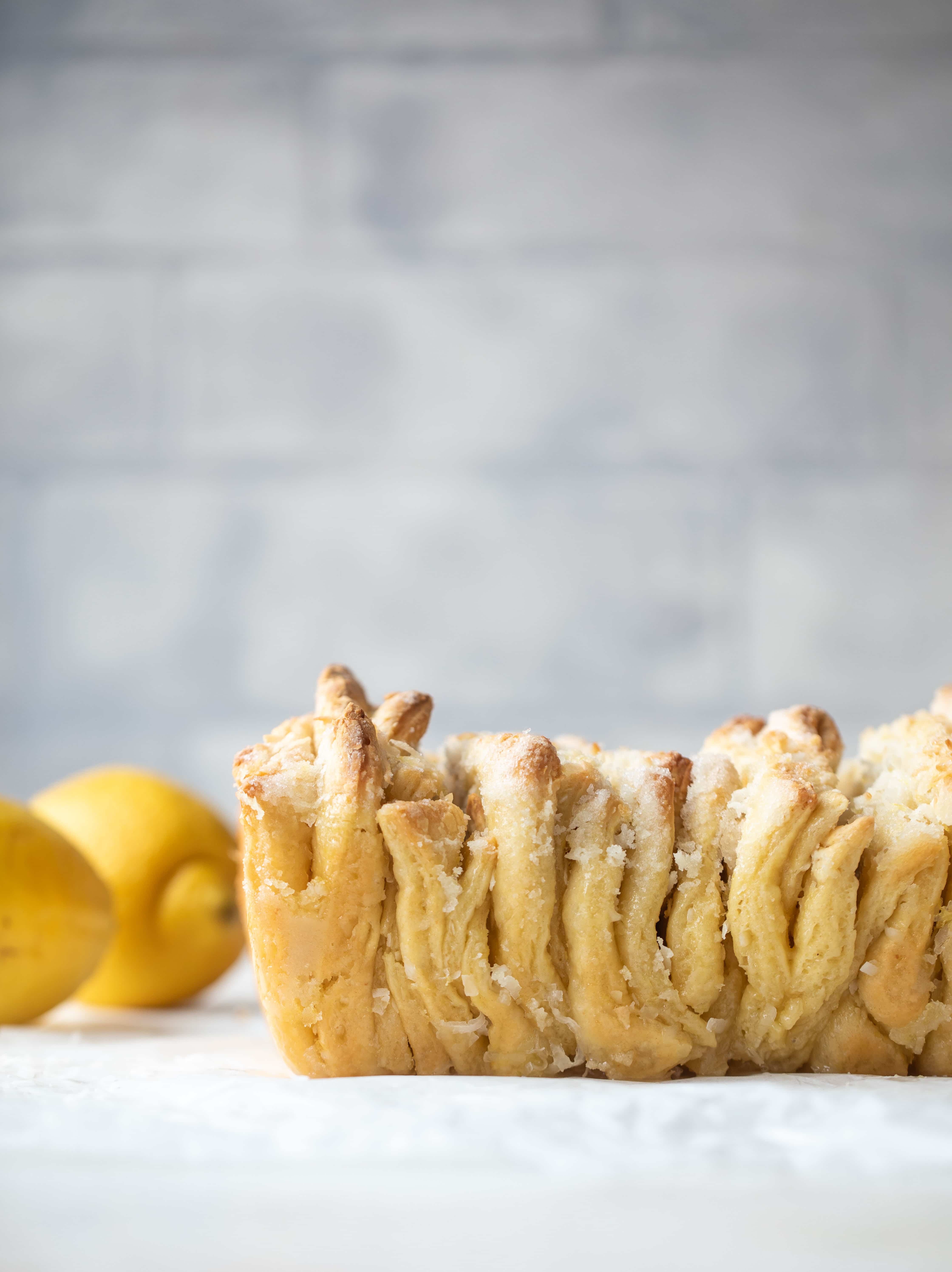 This lemon coconut bread is a pull apart dream! It's perfect for brunch or dessert with the perfect amount of fluffiness. 