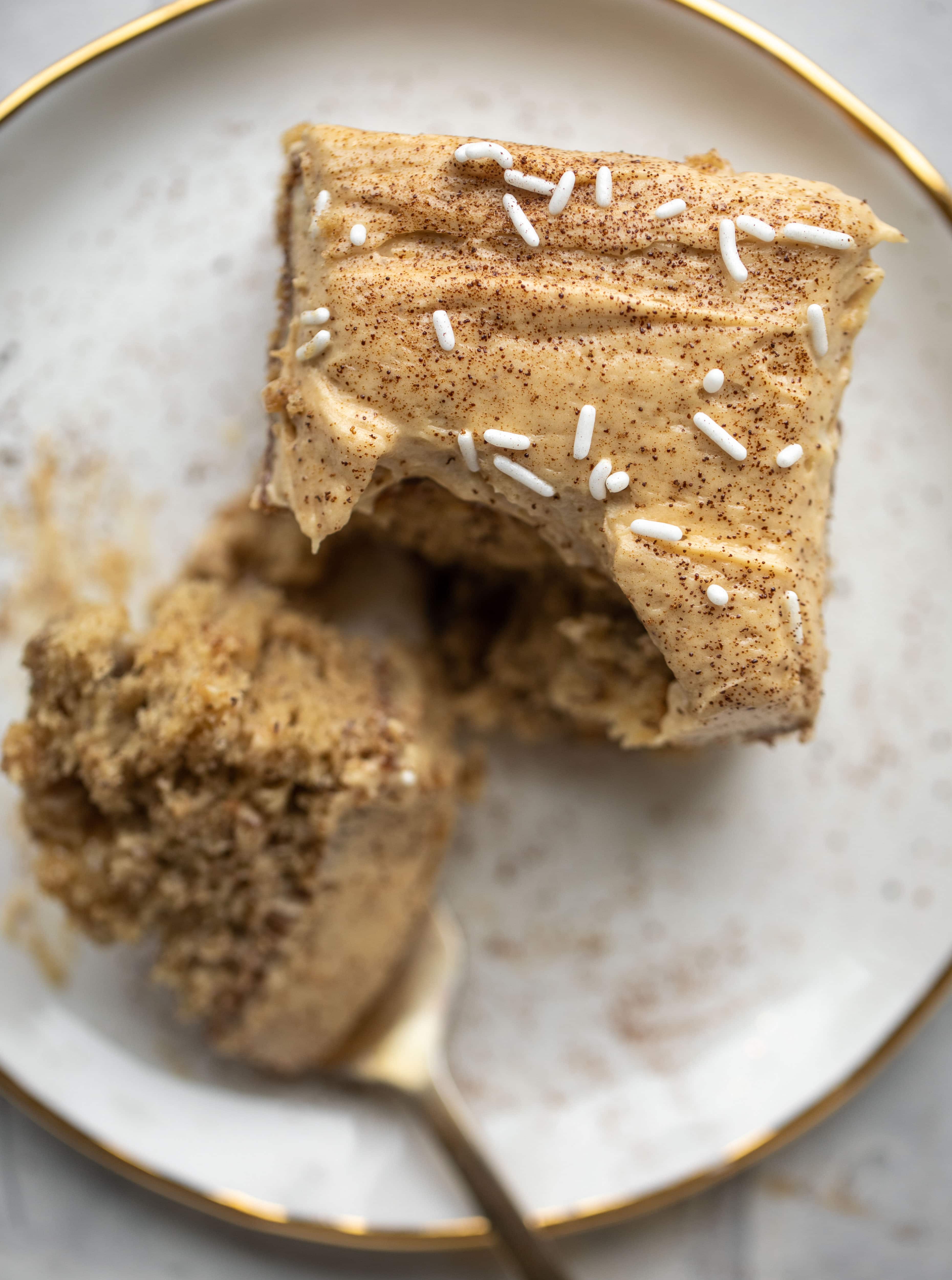 This banana cake is a delicious twist on banana bread! Covered with coffee cream cheese frosting, it’s an easy and wonderful treat.