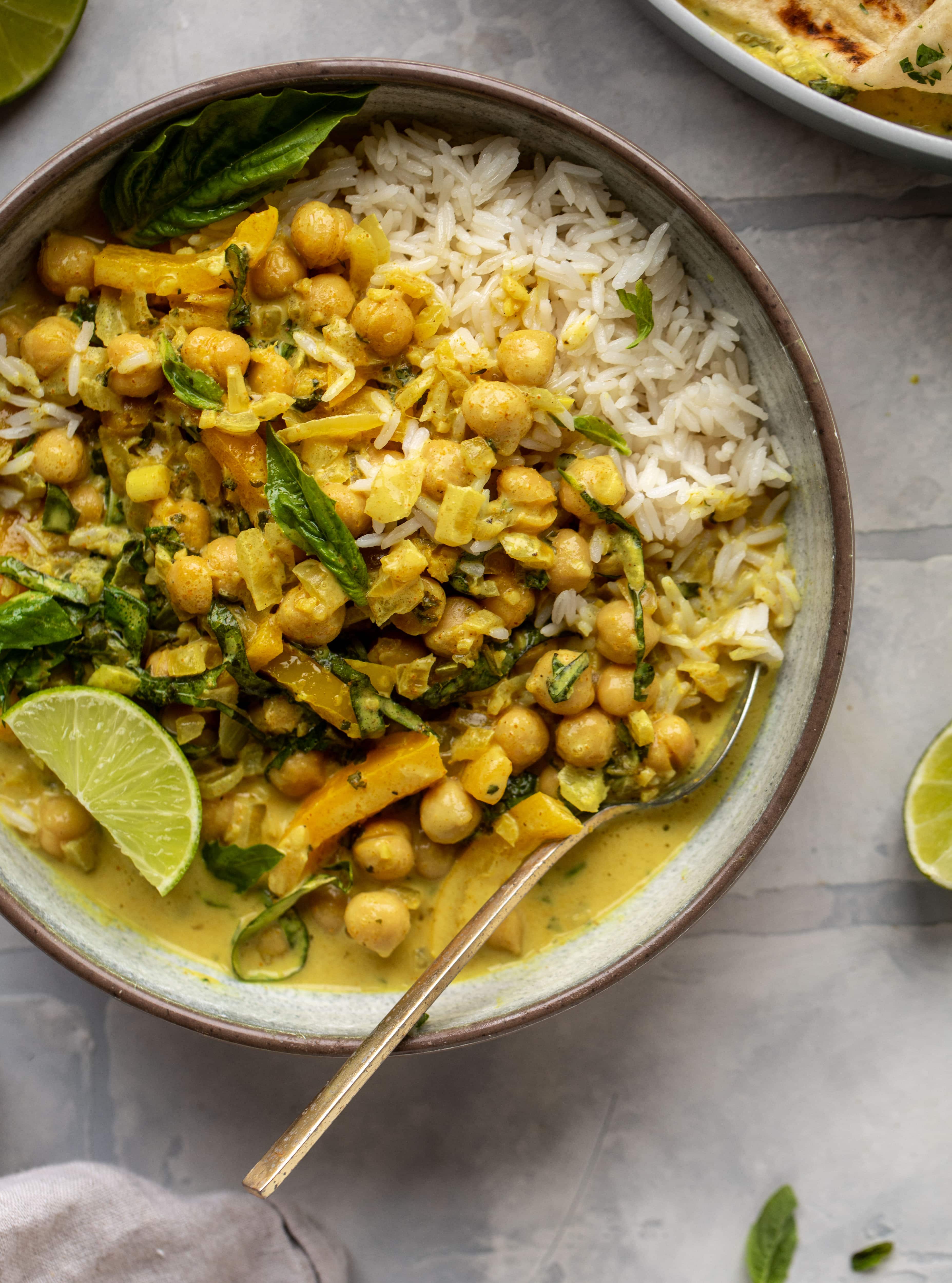 This basil chickpea coconut curry comes together in 20 minutes! Serve with jasmine rice or your favorite naan, or both! So easy and flavorful.