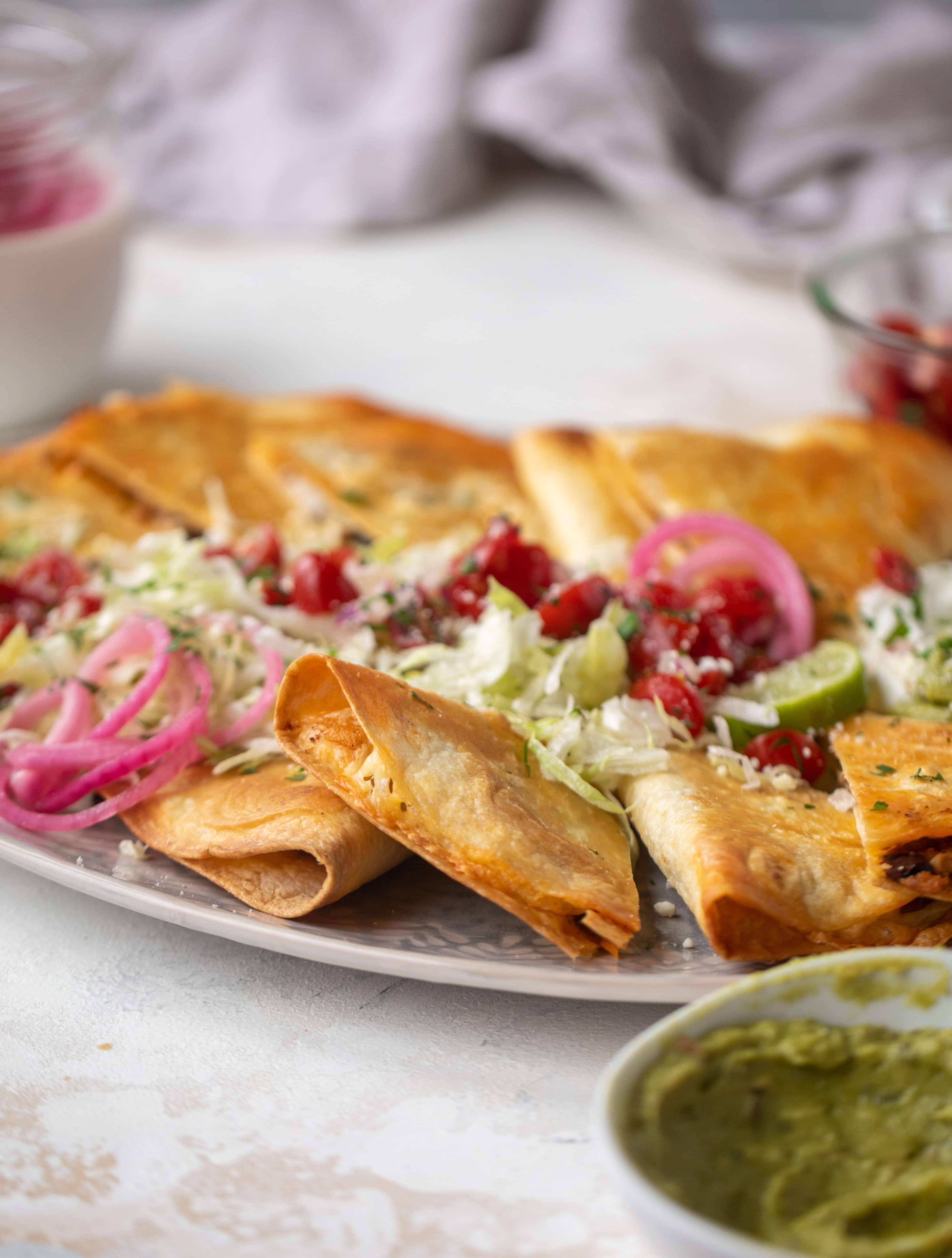 These crispy baked quesadillas will change your life! Make a big batch at once using pantry ingredients and your favorite cheese. 