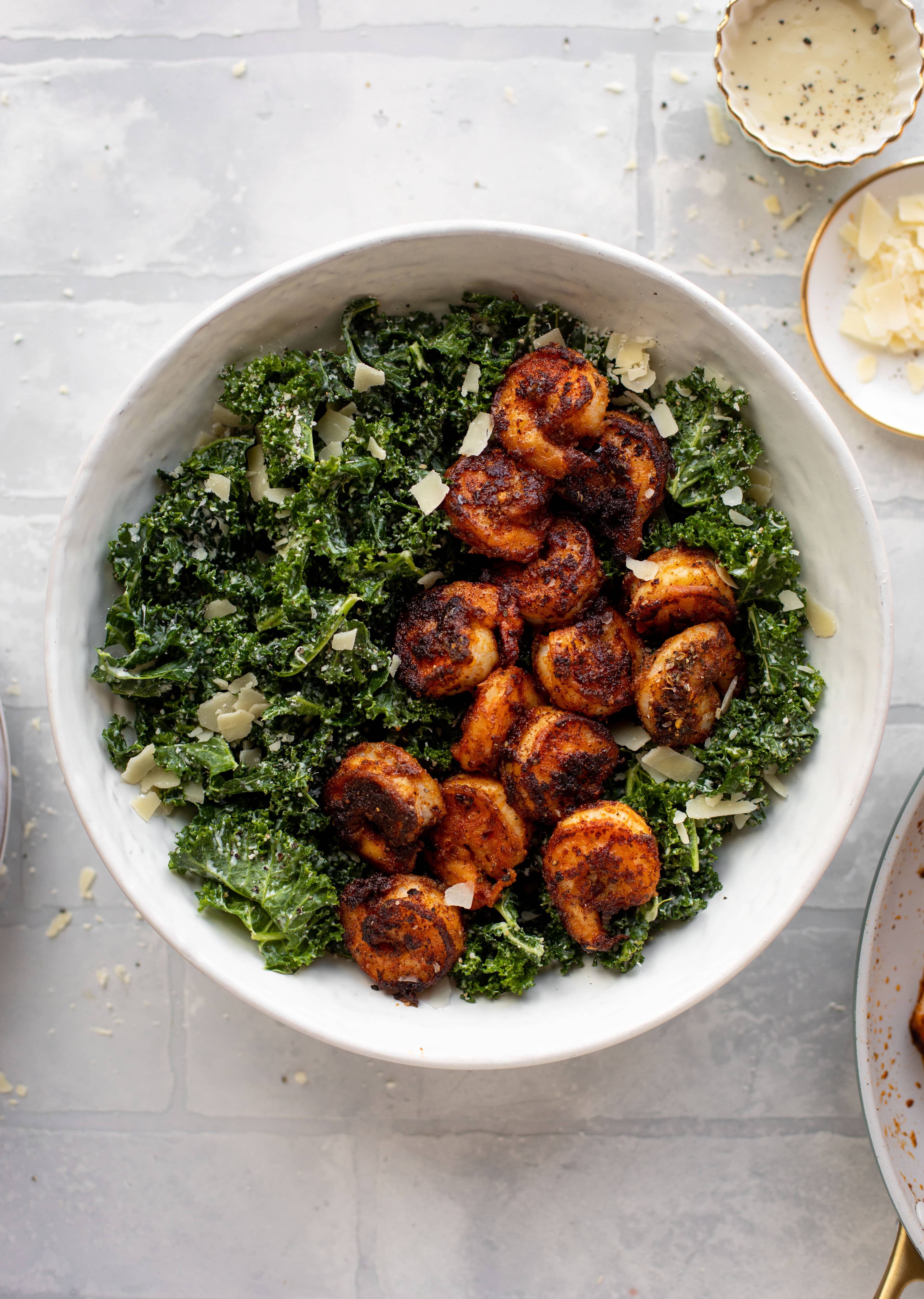 This blackened shrimp kale caesar is loaded with flavor. Spiced, buttery shrimp pan fried until golden, then thrown on kale caesar salad. Delish!