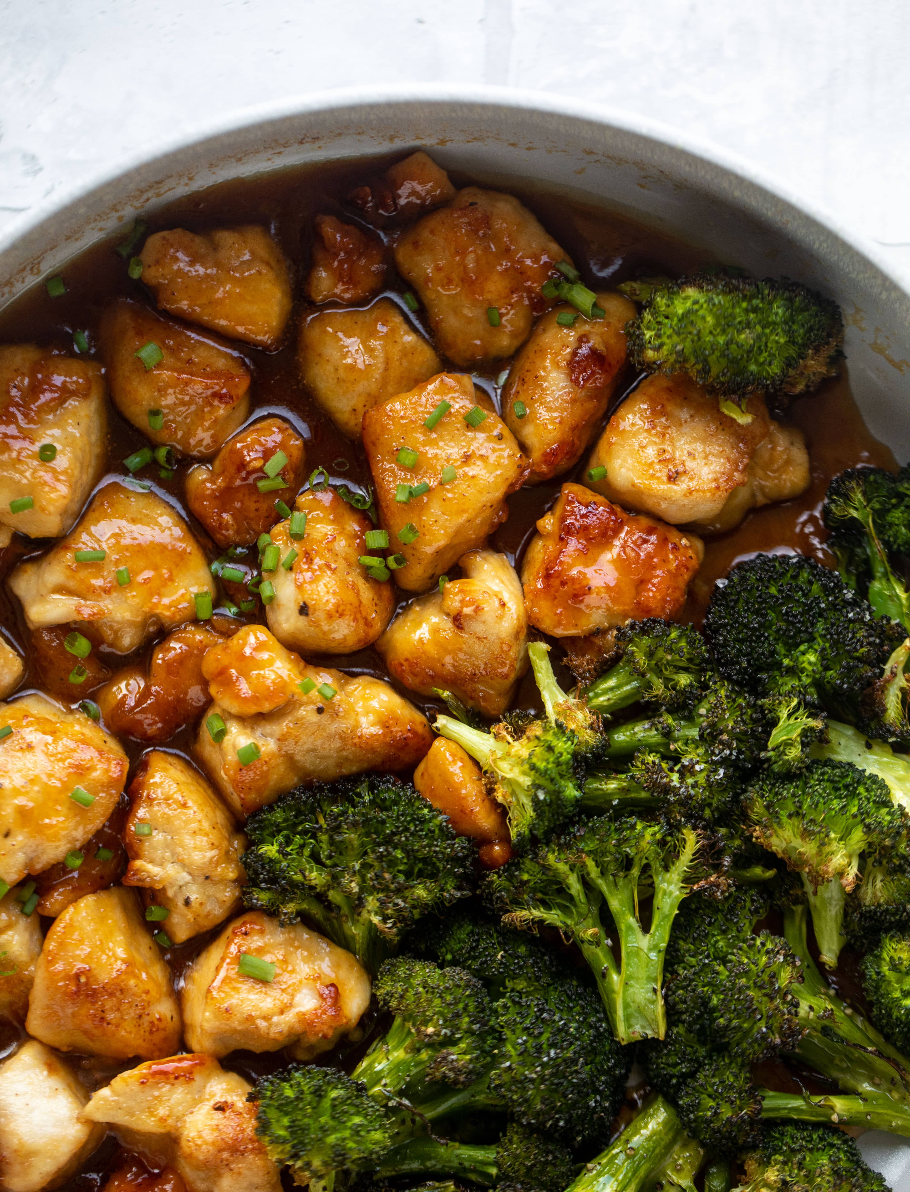 This sticky apricot chicken is so juicy and delicious! The chicken is seared and glazed with a jammy apricot sauce. Serve with broccoli and rice!