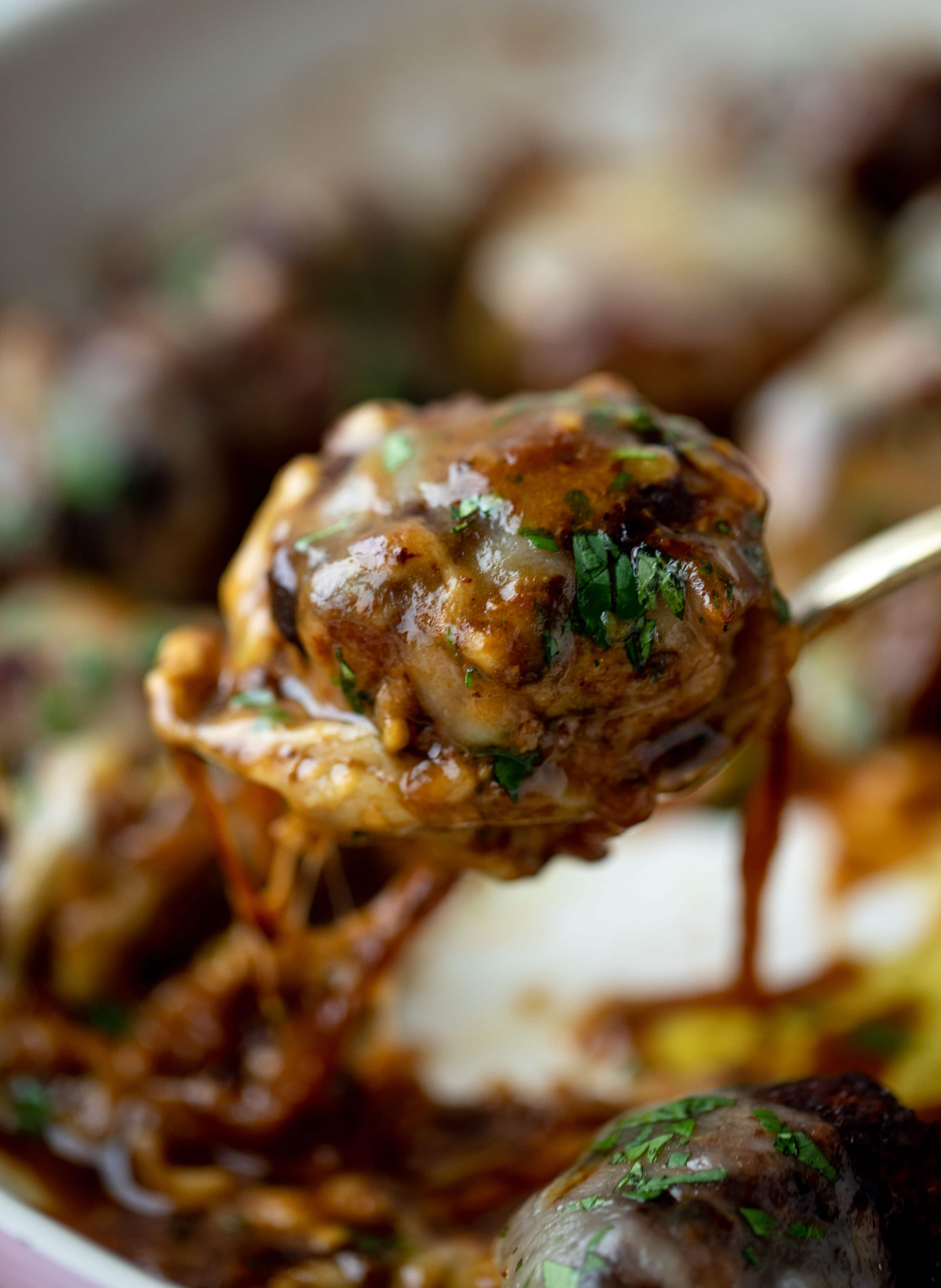 These french onion meatballs are super delicious! All the flavors of french onion soup made into juicy meatballs. Cheesy, saucy goodness!