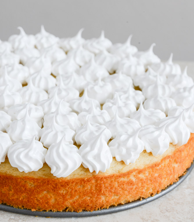 Easy Lemon Cake with Marshmallow Frosting + Toasted Coconut I howsweeteats.com