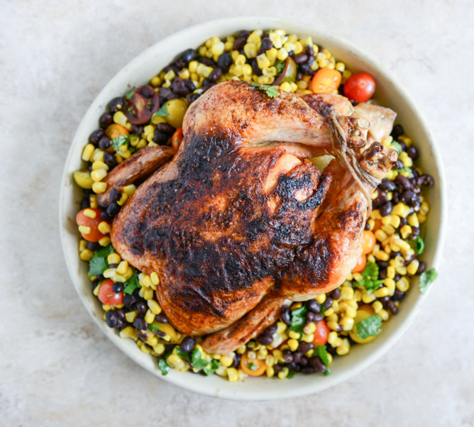chipotle lime butter whole roasted chicken with the easiest black bean + corn salad.