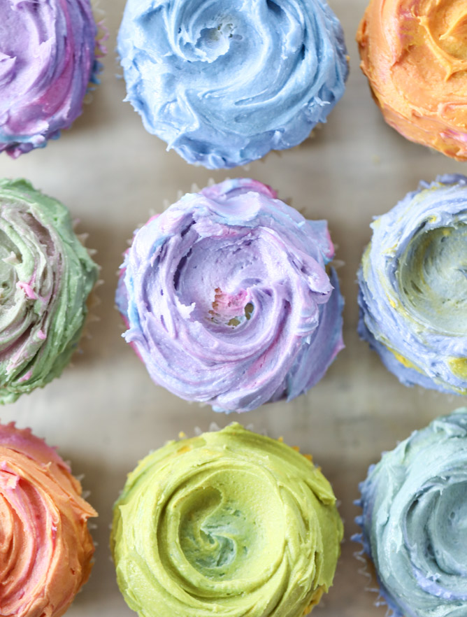 olive oil cupcakes with rainbow mascarpone buttercream. {video!}