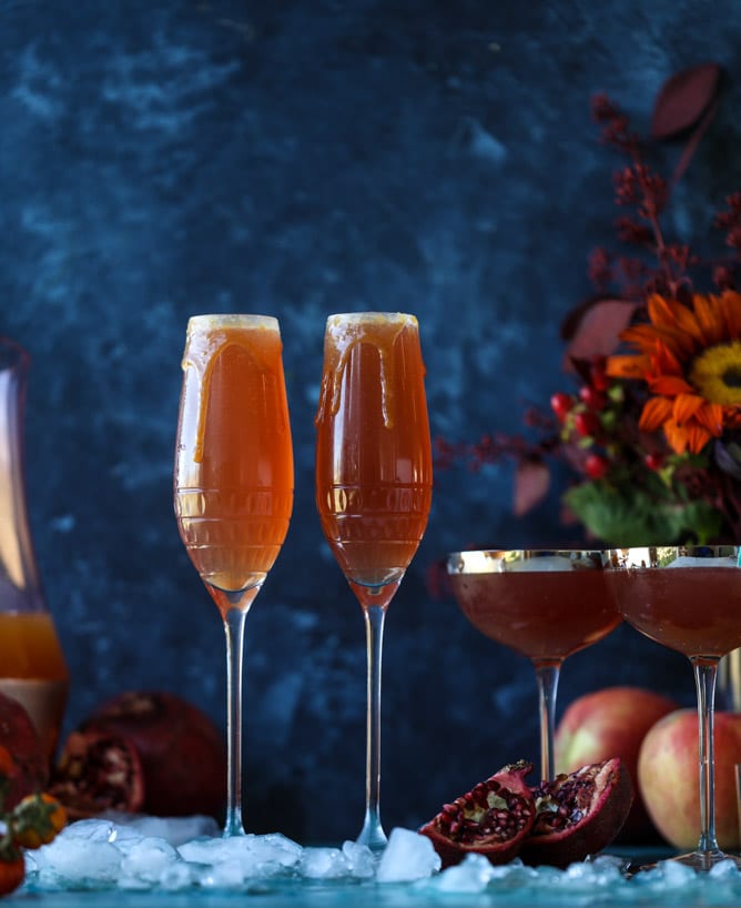 pomegranate cider mimosas with a salted caramel rim I howsweeteats.com #cocktails #thanksgiving #applecider #mimosas