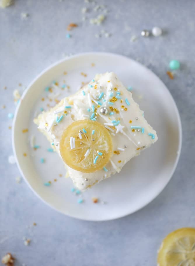 lemon sheet cake with cream cheese frosting I howsweeteats.com #lemon #cake #sheetcake #dessert #creamcheesefrosting
