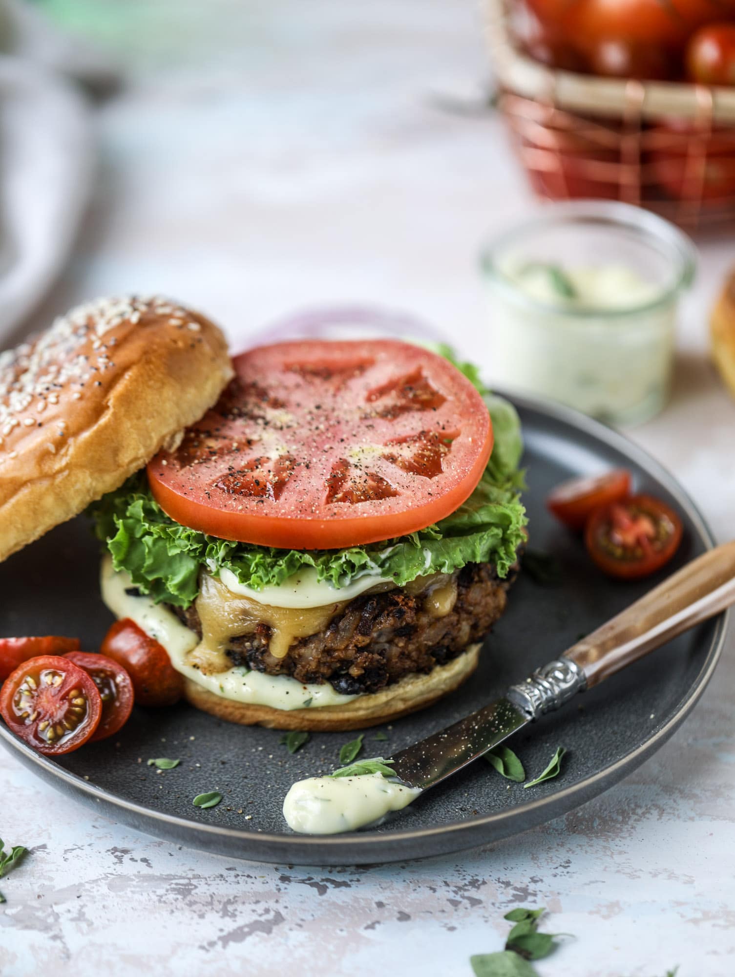 This is the best ever veggie burger and that is not an exaggeration! It's delicious, full of texture and chew, super satisfying and actually sticks together in the pan. You can serve it on buns, make a patty melt, a salad or lettuce wraps - perfection! I howsweeteats.com #best #veggie #burger #vegetarian #beans #quinoa