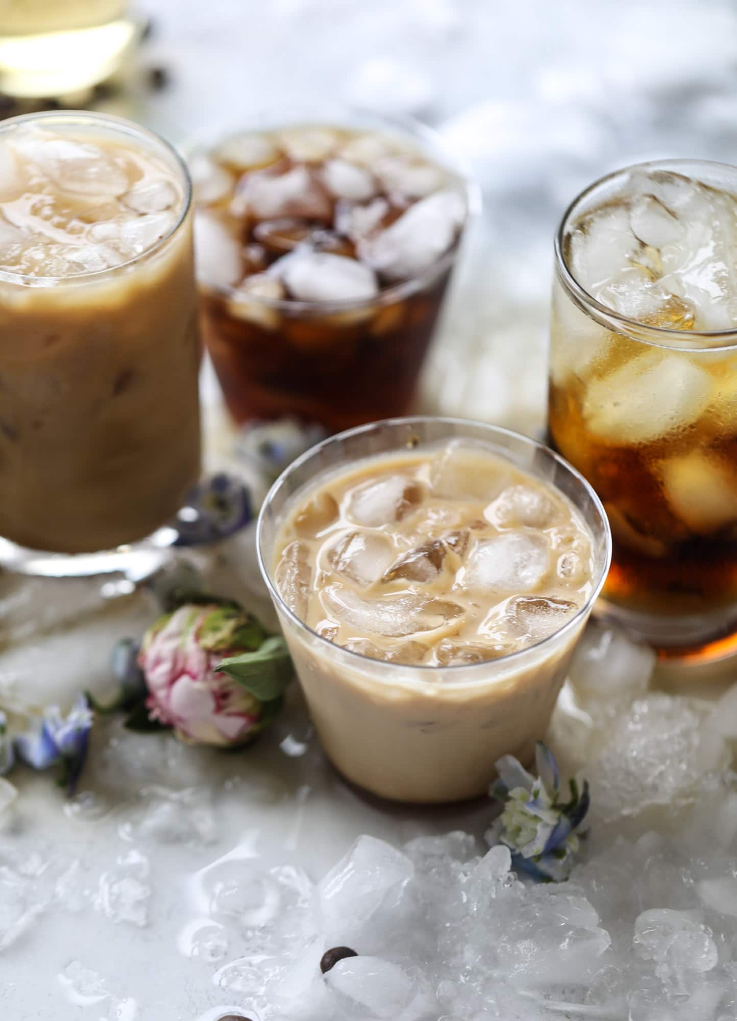 This iced coffee soda is so perfect for summer! Rich coconut syrup, cold brew coffee, cream (or coconut cream!) if you'd like it and lots of bubbly soda. Tastes refreshing, feels like a cocktail and still gives you a pick-me-up! I howsweeteats.com #iced #coffee #soda #coconut