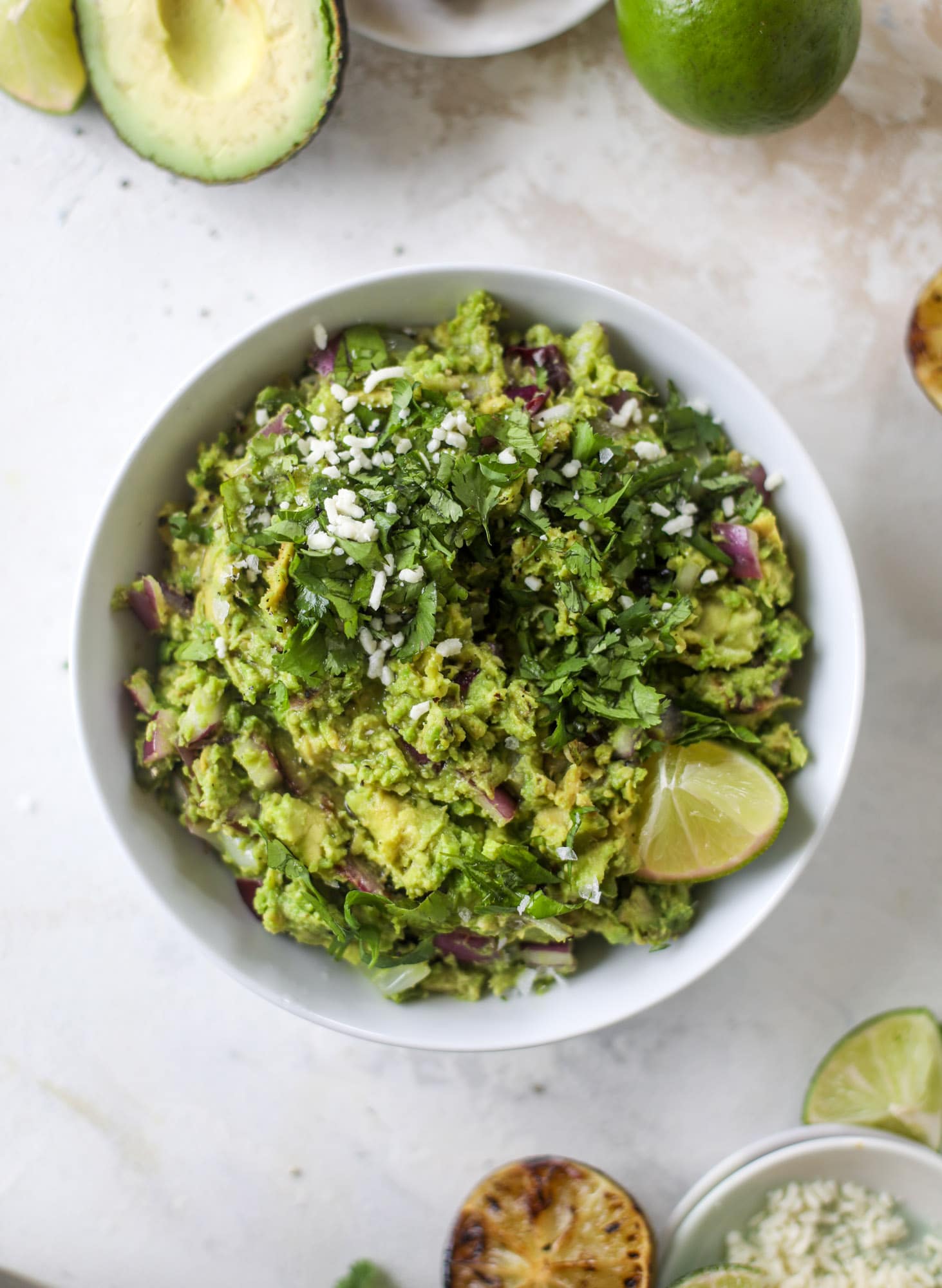 Take your guac up a notch by grilling the ingredients! This grilled guacamole is smoky and flavorful and just begging for all the chips.