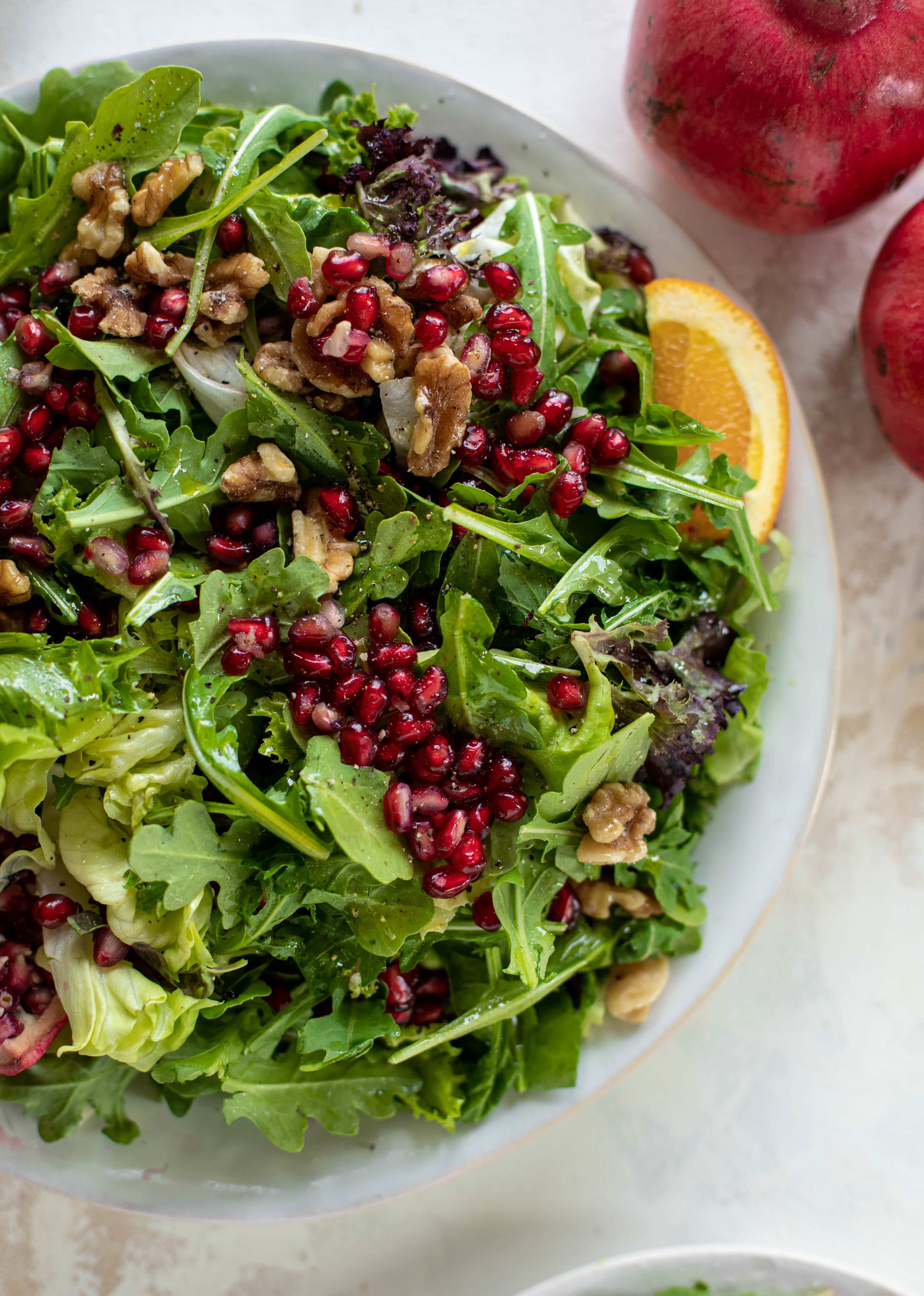 A pomegranate halloumi salad that's the perfect starter to your holiday meal! Drizzle with a spiced orange vinaigrette for the most festive flavor ever.
