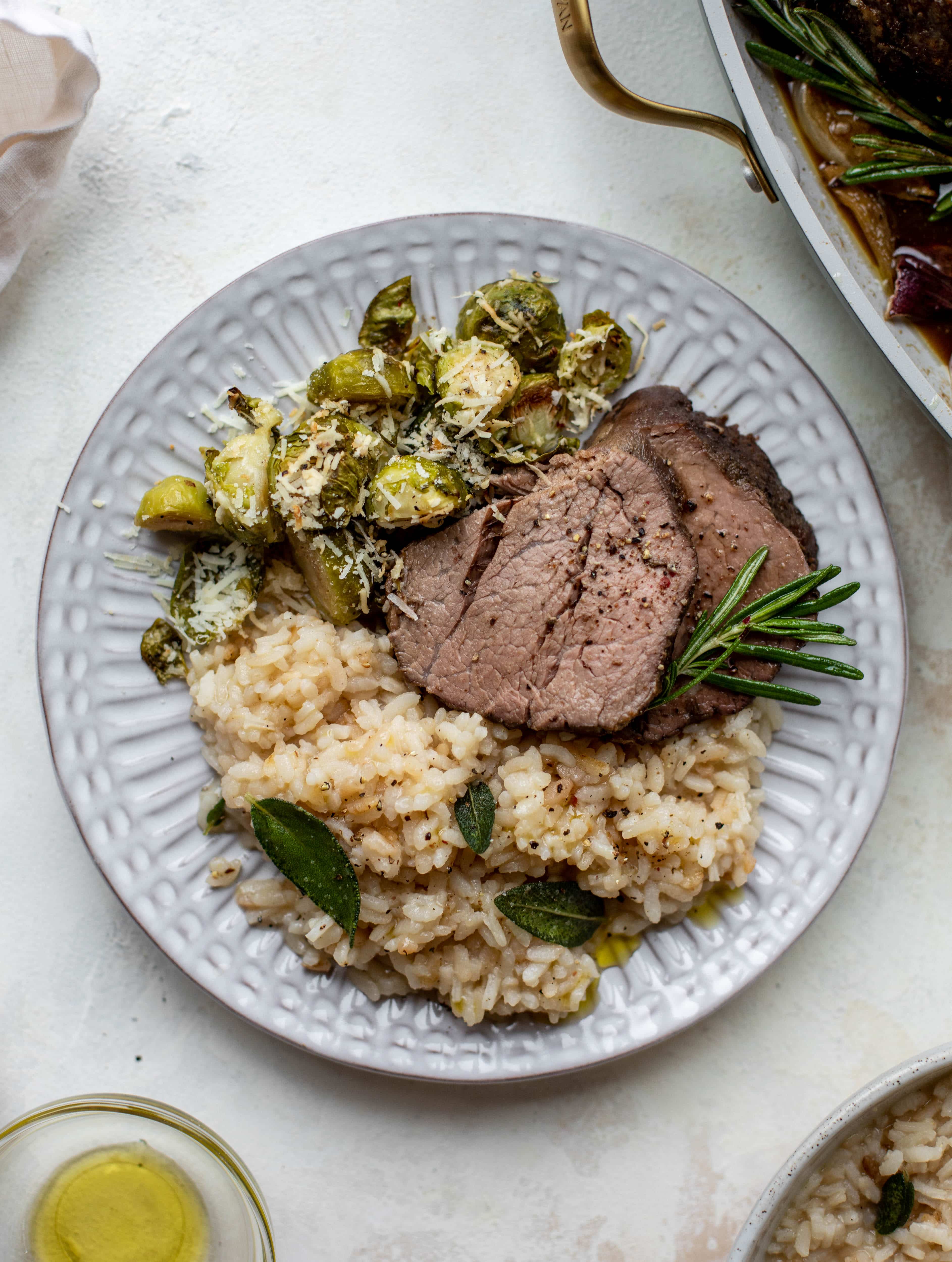The ultimate special occasion meal! Espresso crusted filet paired with truffle sage risotto and cacio e pepe brussels. So much flavor - it's perfect for the holidays!