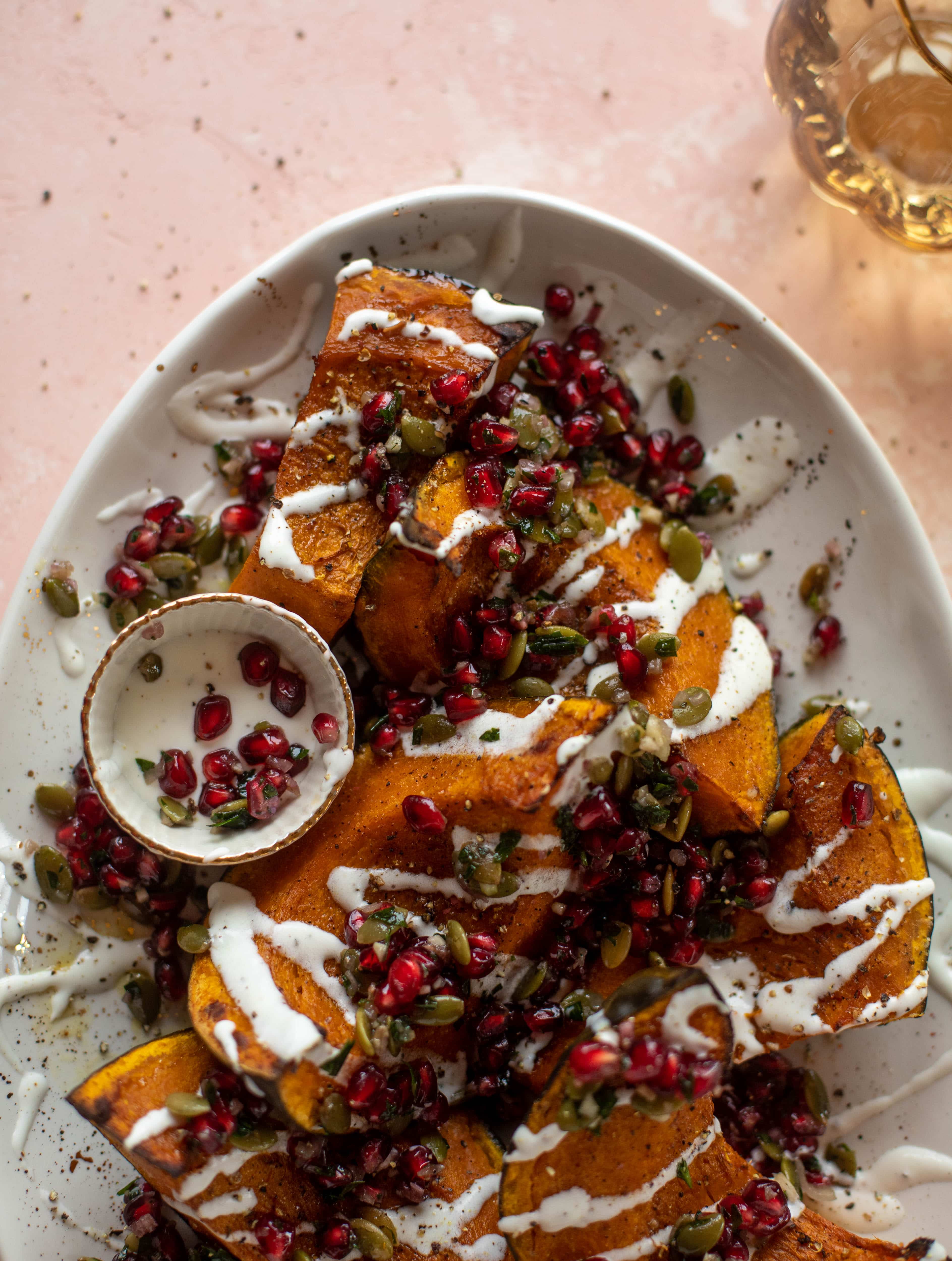 This roasted kabocha squash is caramely and naturally sweet, drizzled with whipped goat cheese and topped with pomegranate pepita relish. It's unreal!
