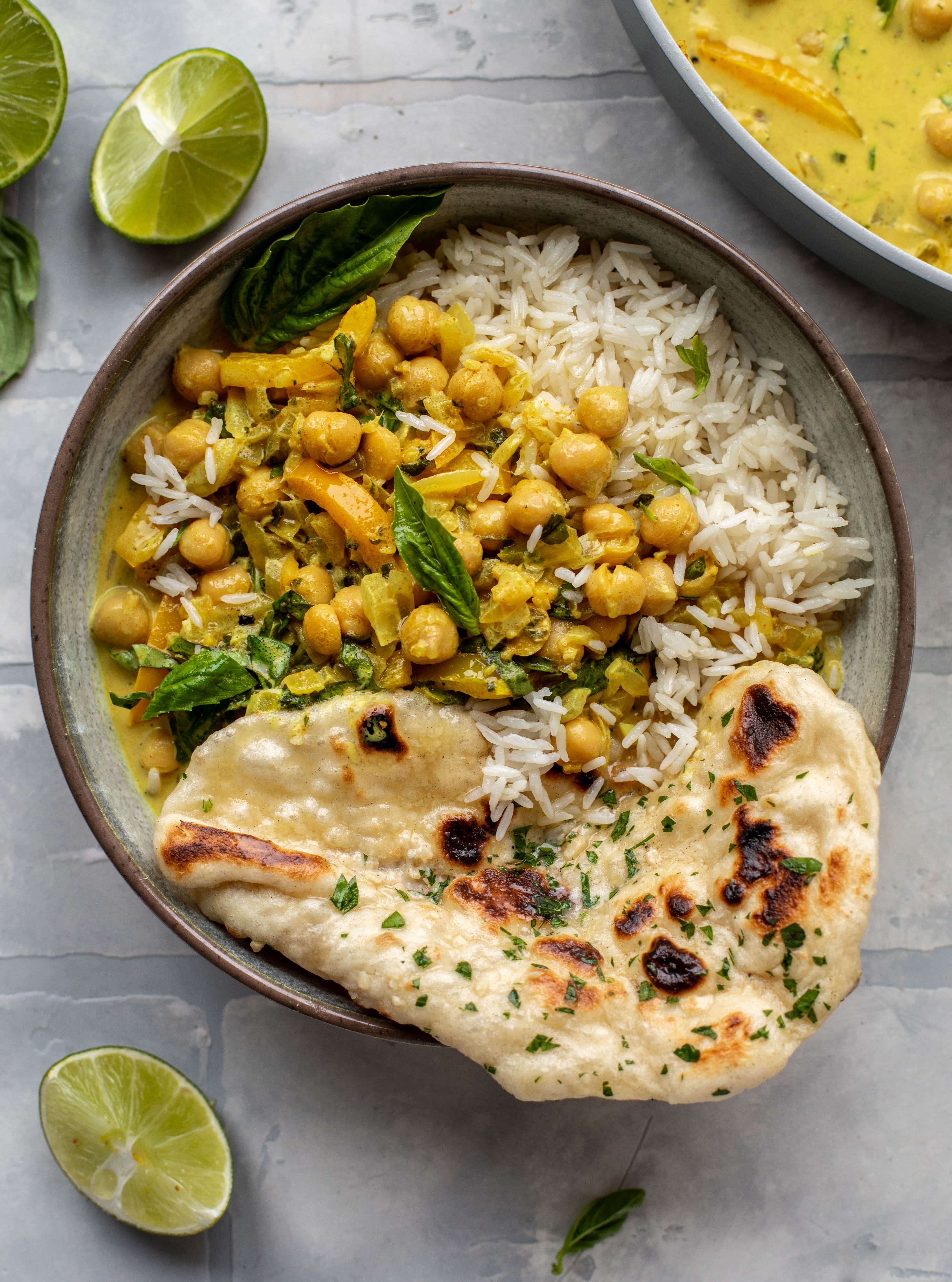 This basil chickpea coconut curry comes together in 20 minutes! Serve with jasmine rice or your favorite naan, or both! So easy and flavorful.