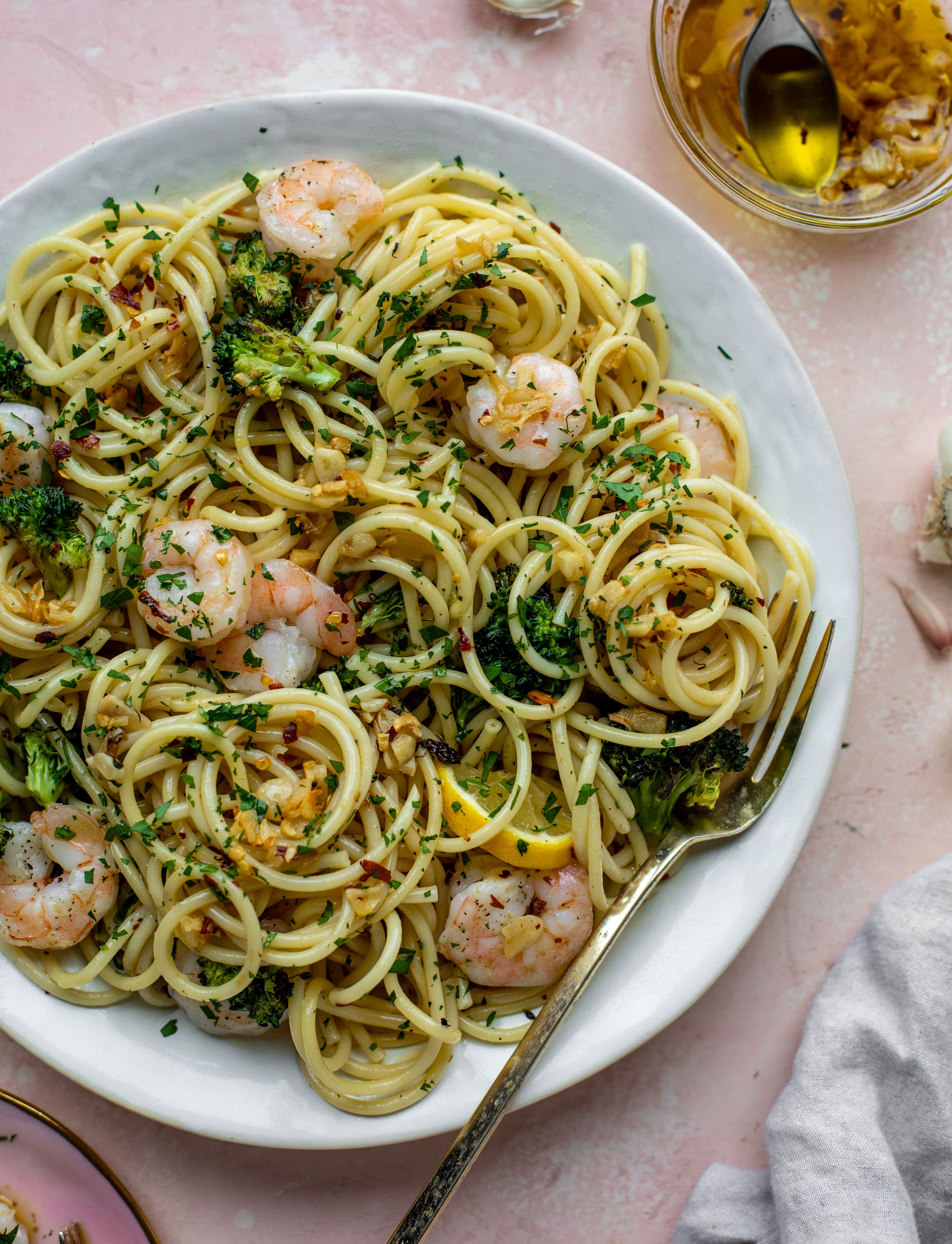 This garlic sauce pasta is incredible! Roasted shrimp and broccoli twirled with garlic oil noodles and crushed red pepper. Divine!