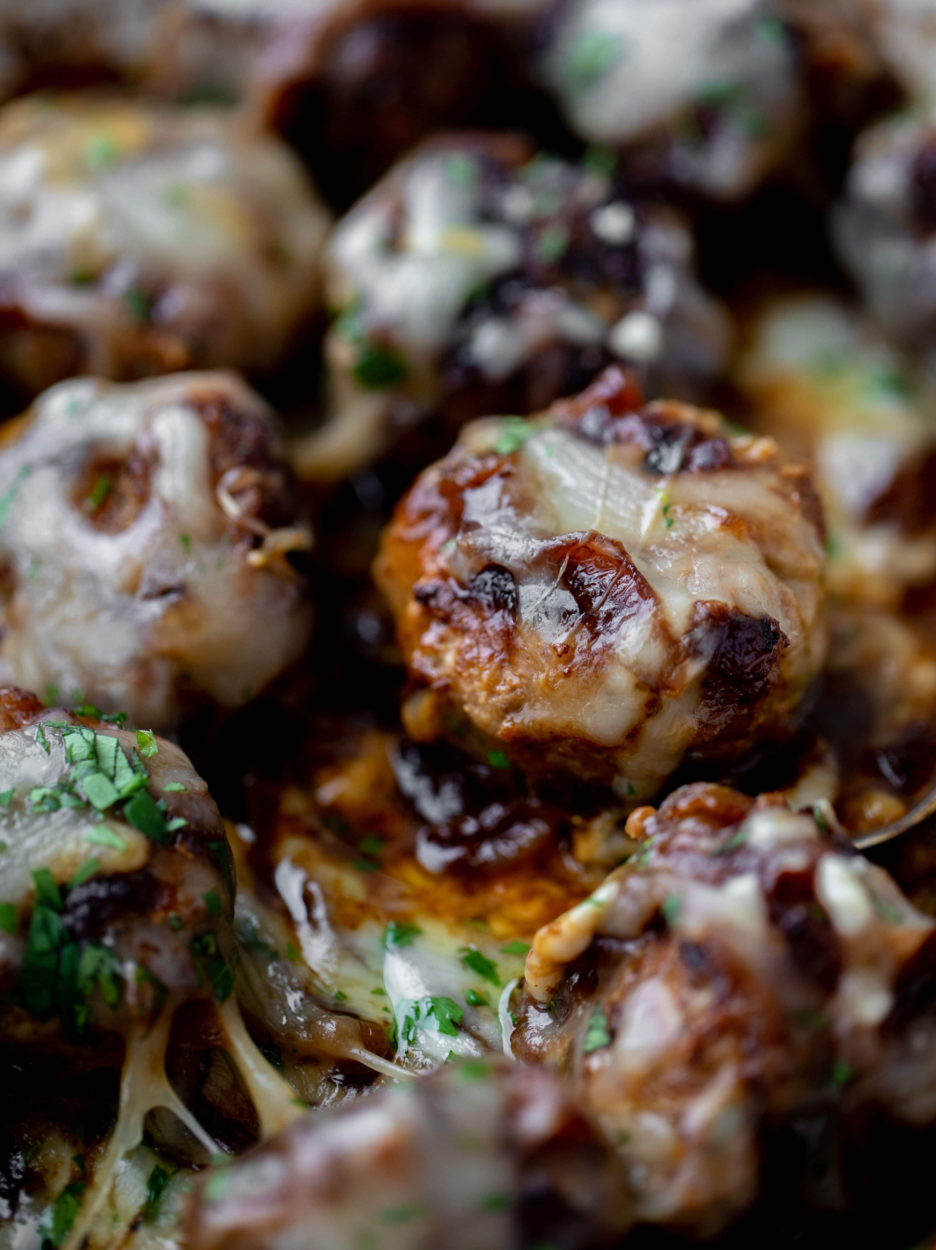 These french onion meatballs are super delicious! All the flavors of french onion soup made into juicy meatballs. Cheesy, saucy goodness!