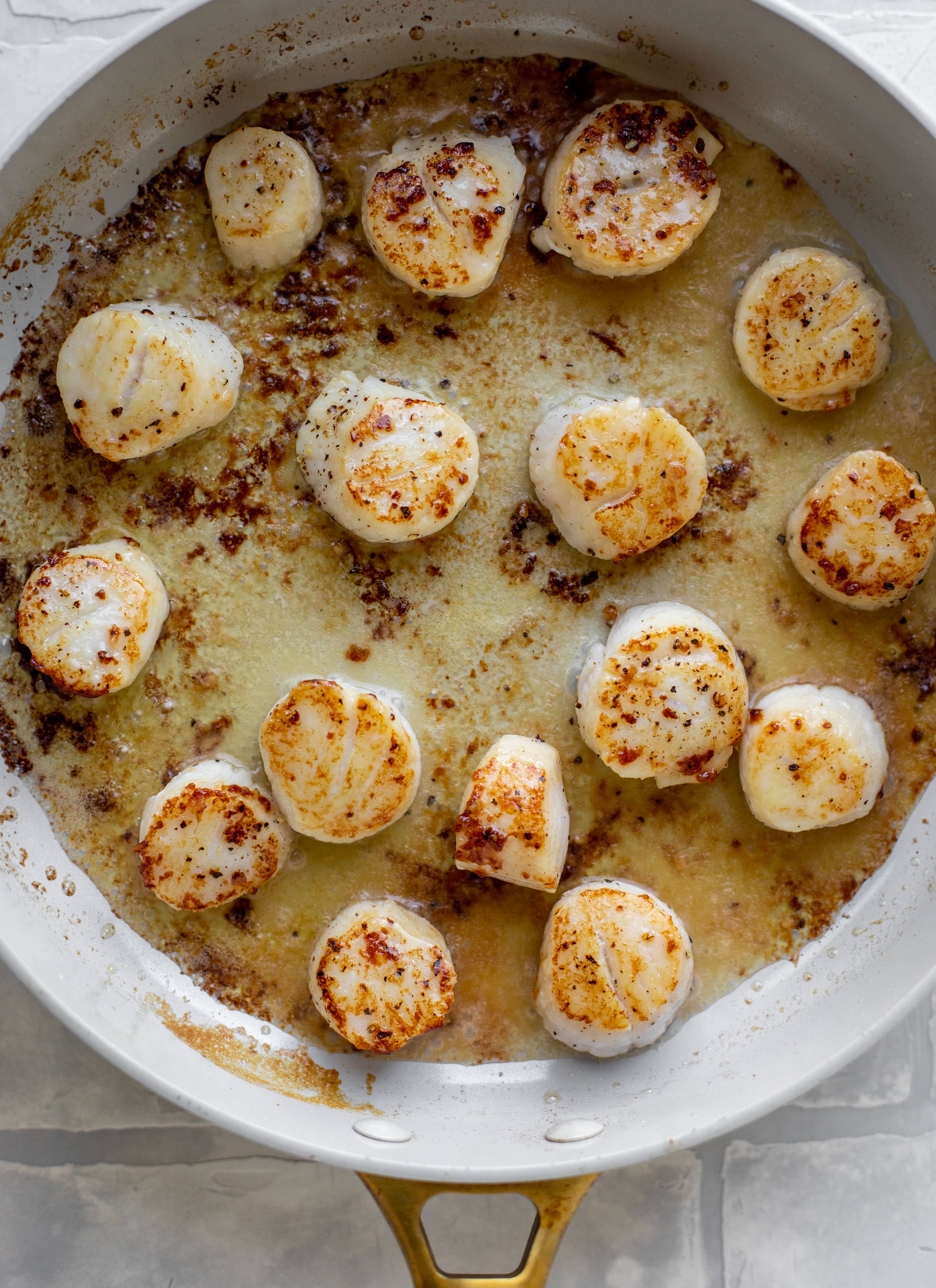 seared garlic butter scallops in skillet