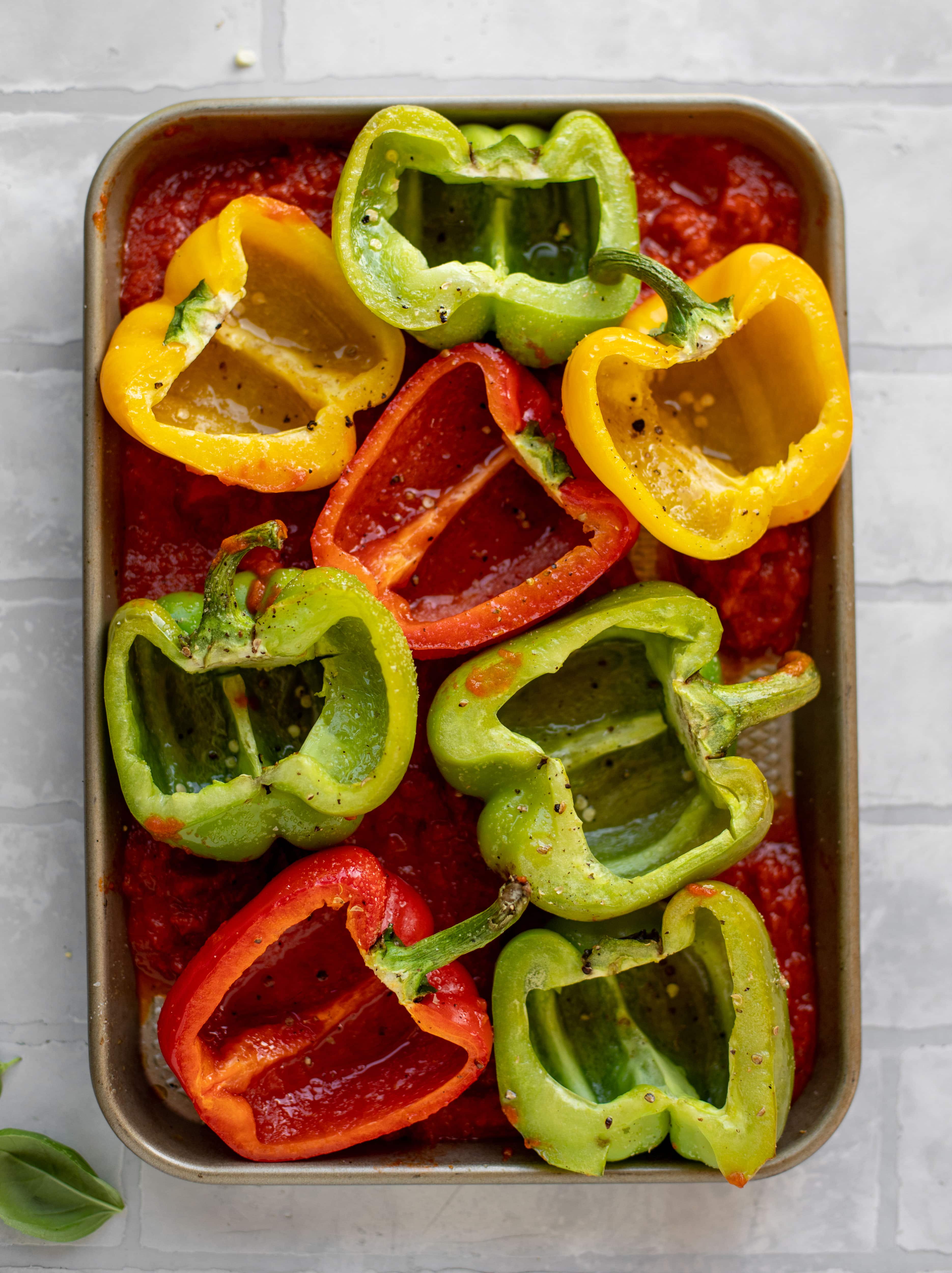 halved bell peppers in sauce