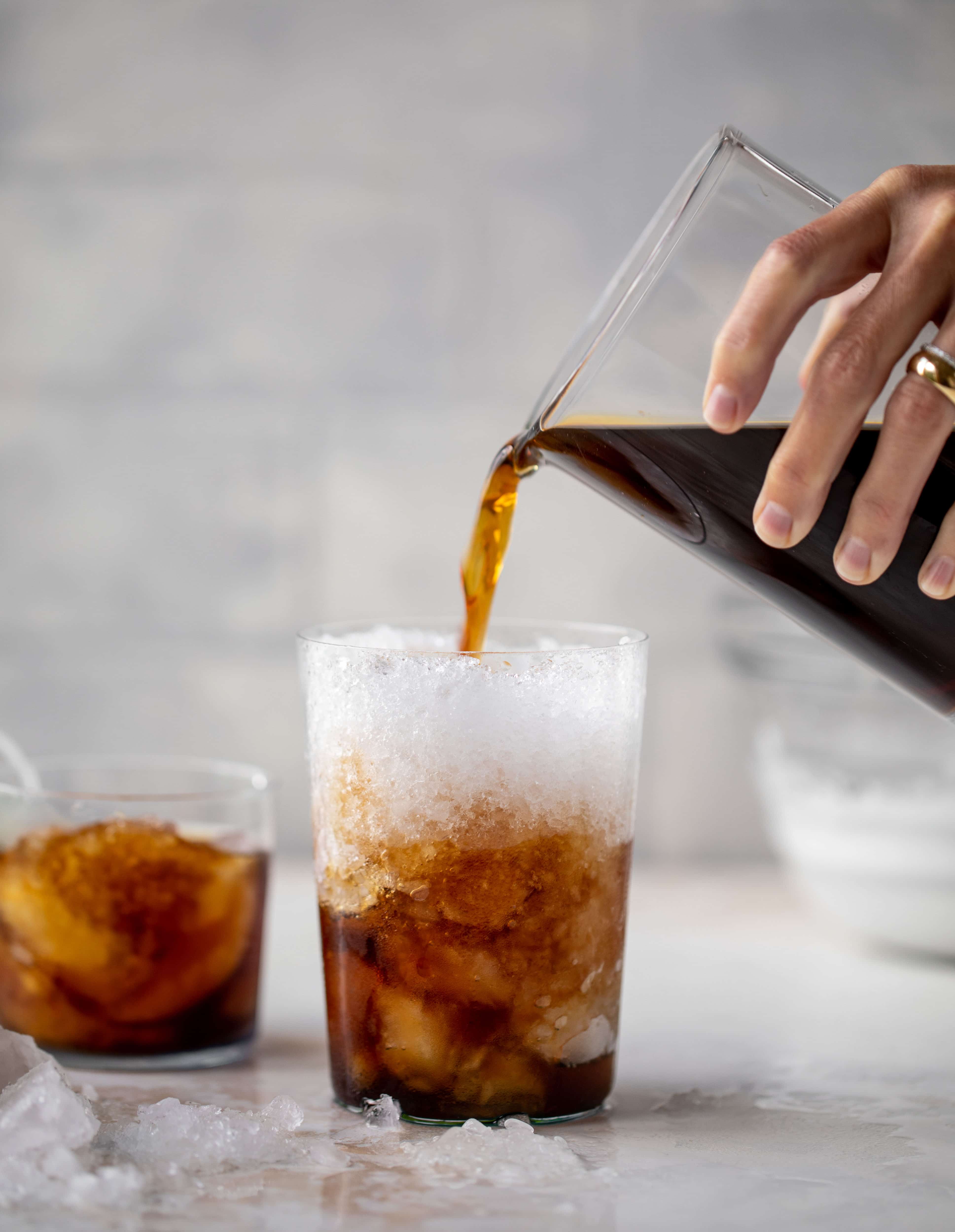 pouring cold brew over ice