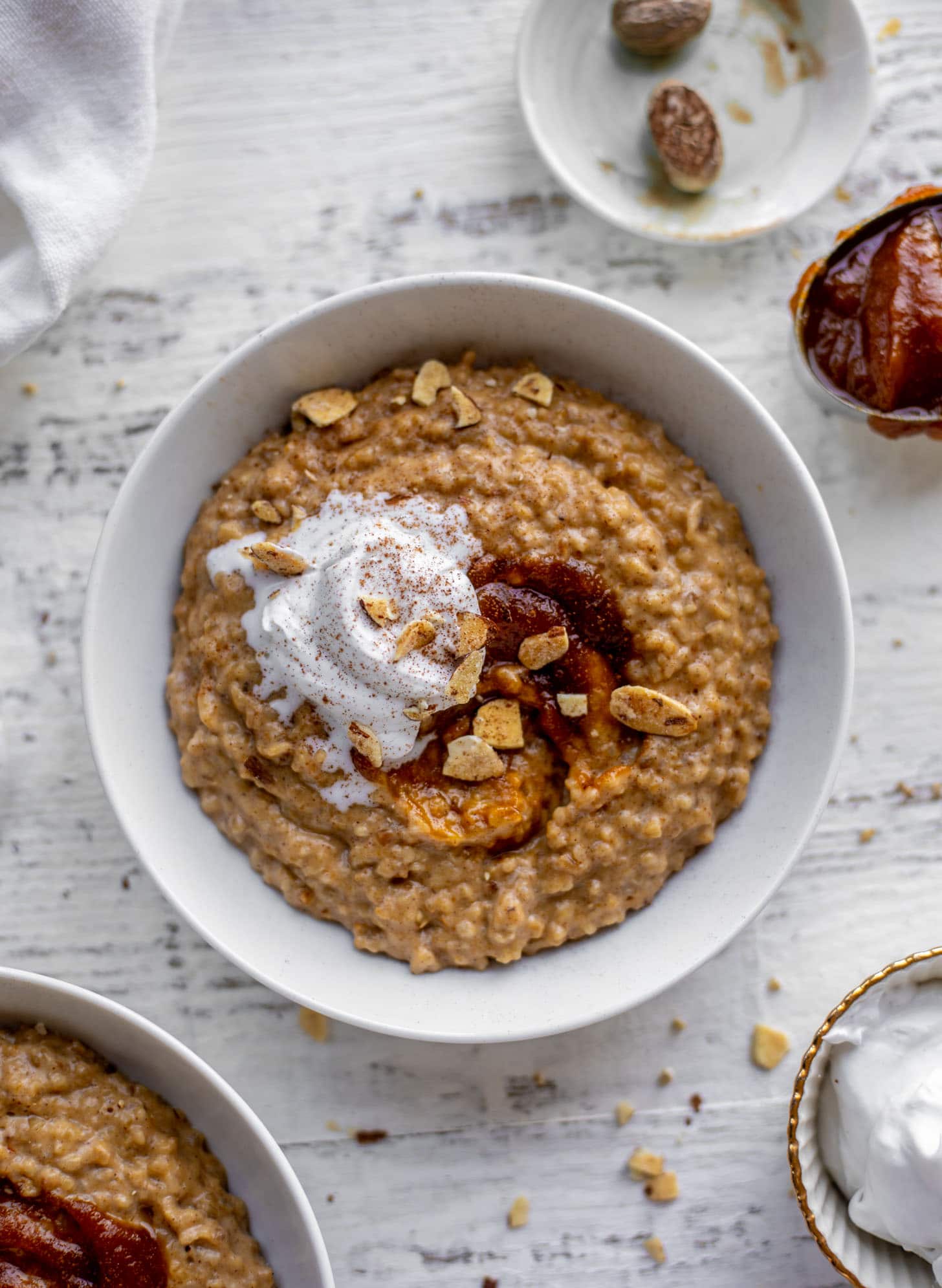 pumpkin pie oatmeal with coconut cream and almonds